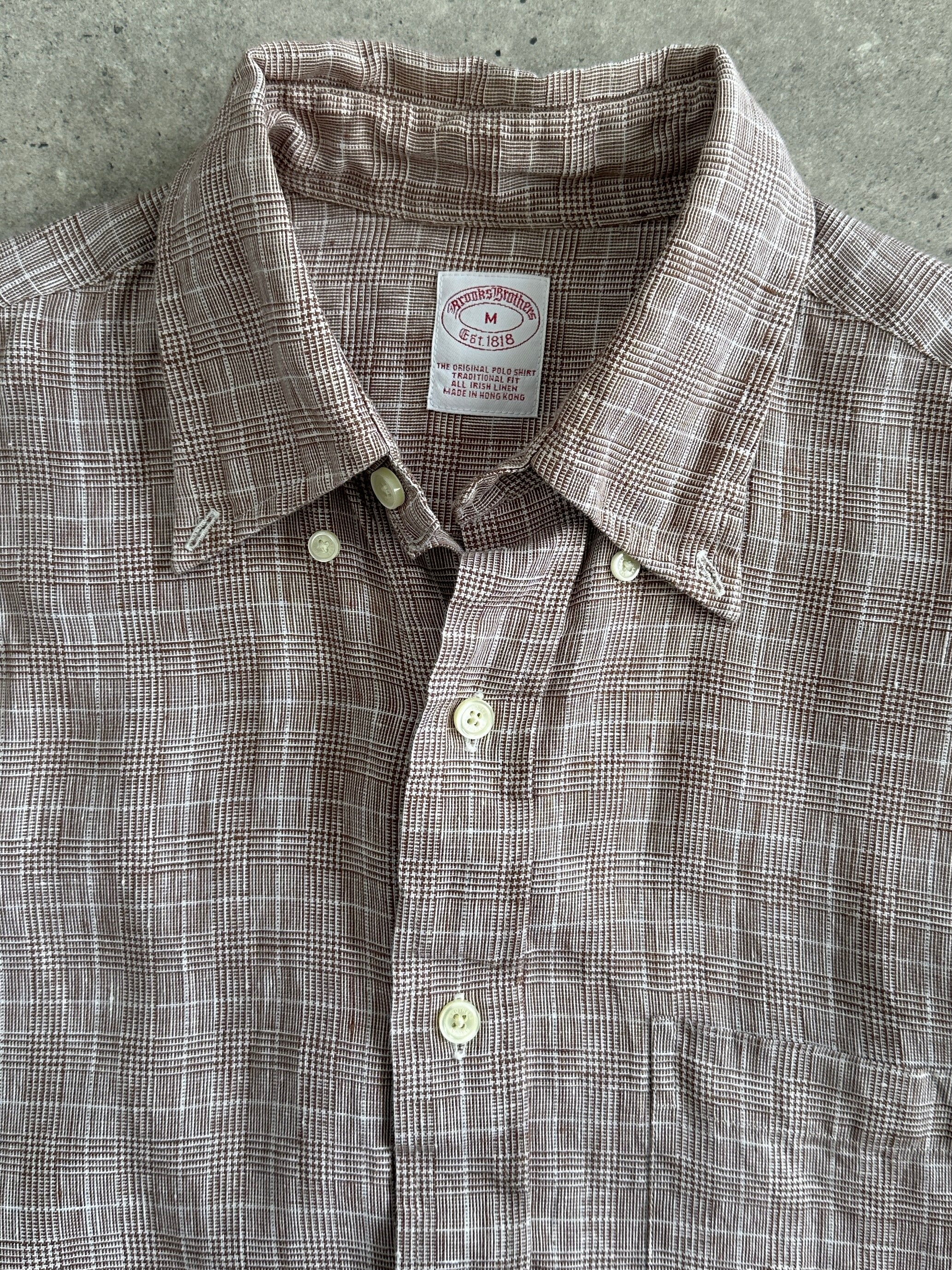 Brooks Brothers cotton check flannel shirt in size L/XL, featuring a classic plaid pattern and button-up front.