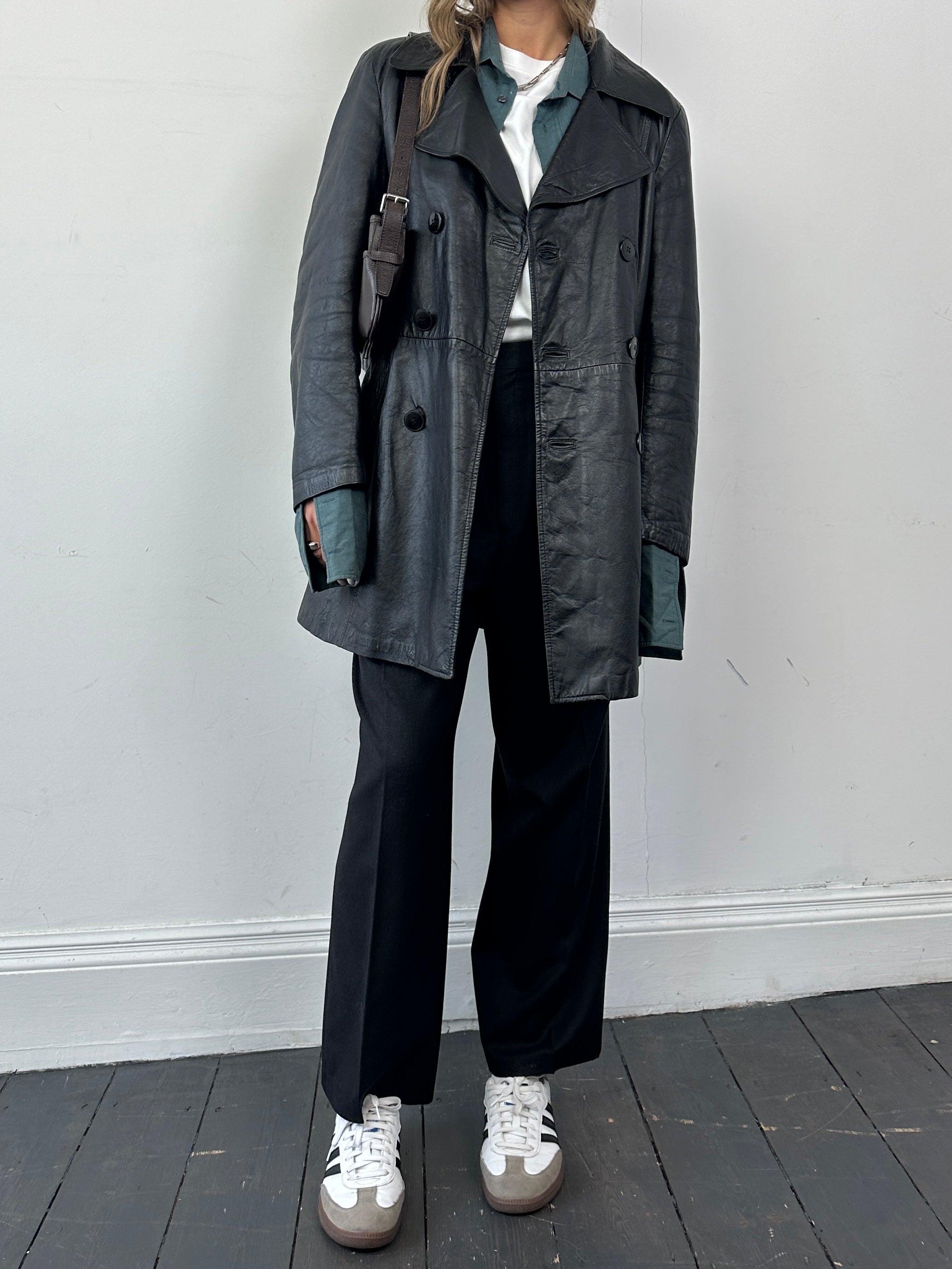 Vintage Italian double-breasted leather jacket in mid-length style, featuring classic design and S/M size details.