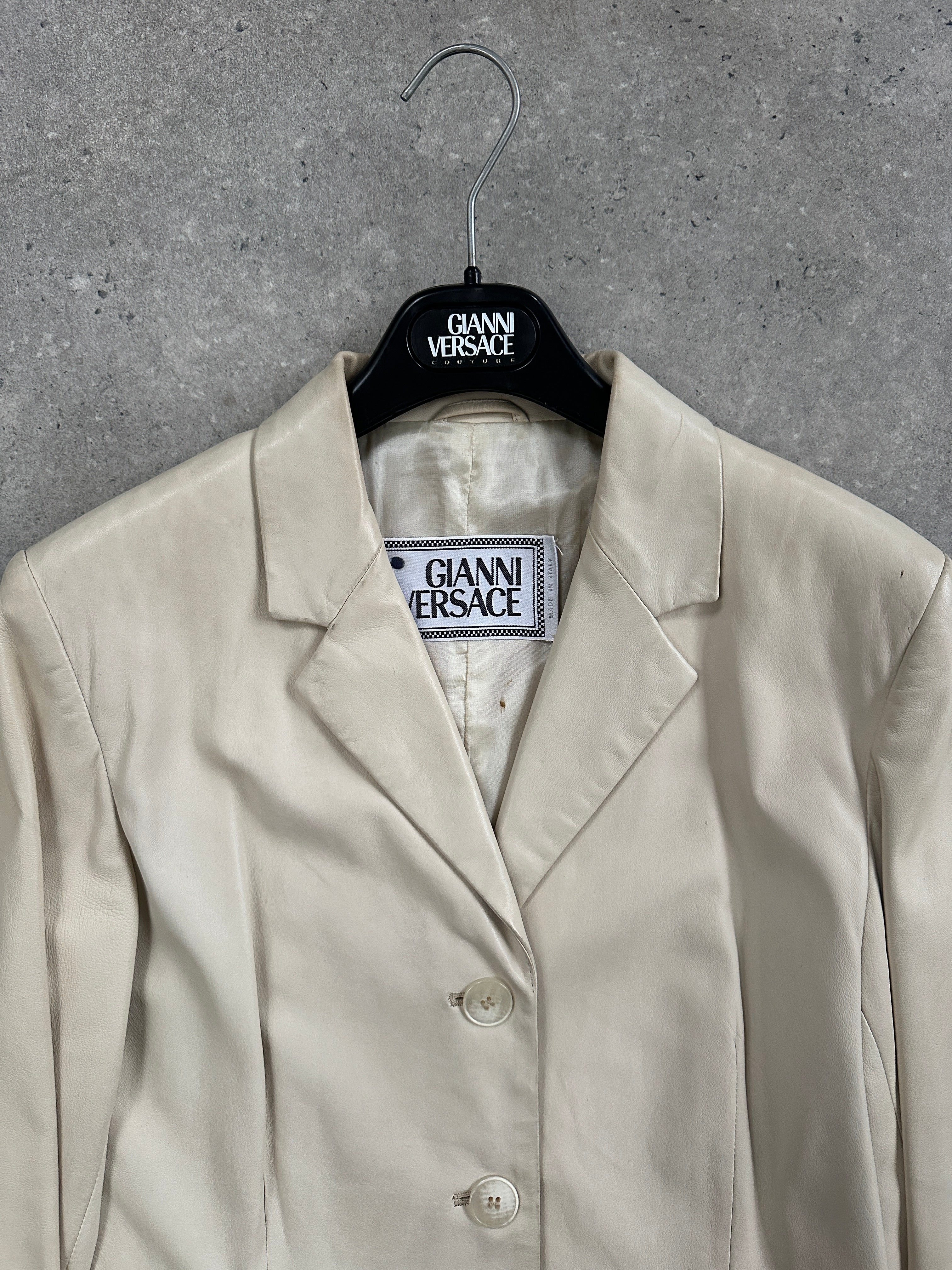 Gianni Versace 1990s black leather jacket with classic design, slim fit, and signature Versace detailing on the front.