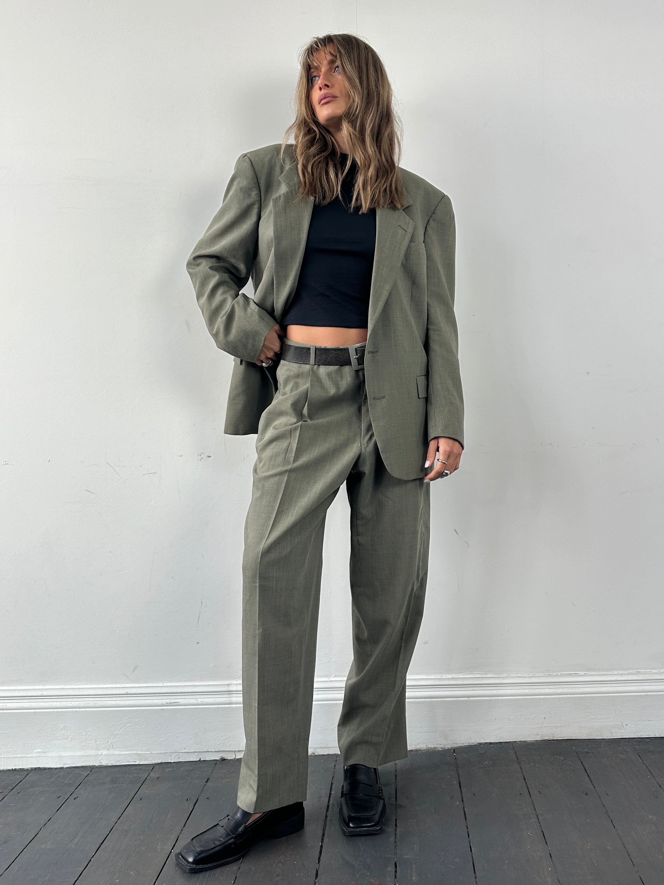 Christian Dior pure virgin wool single-breasted suit jumpsuit in size 42R/W32, tailored fit with classic lapel and button closure.