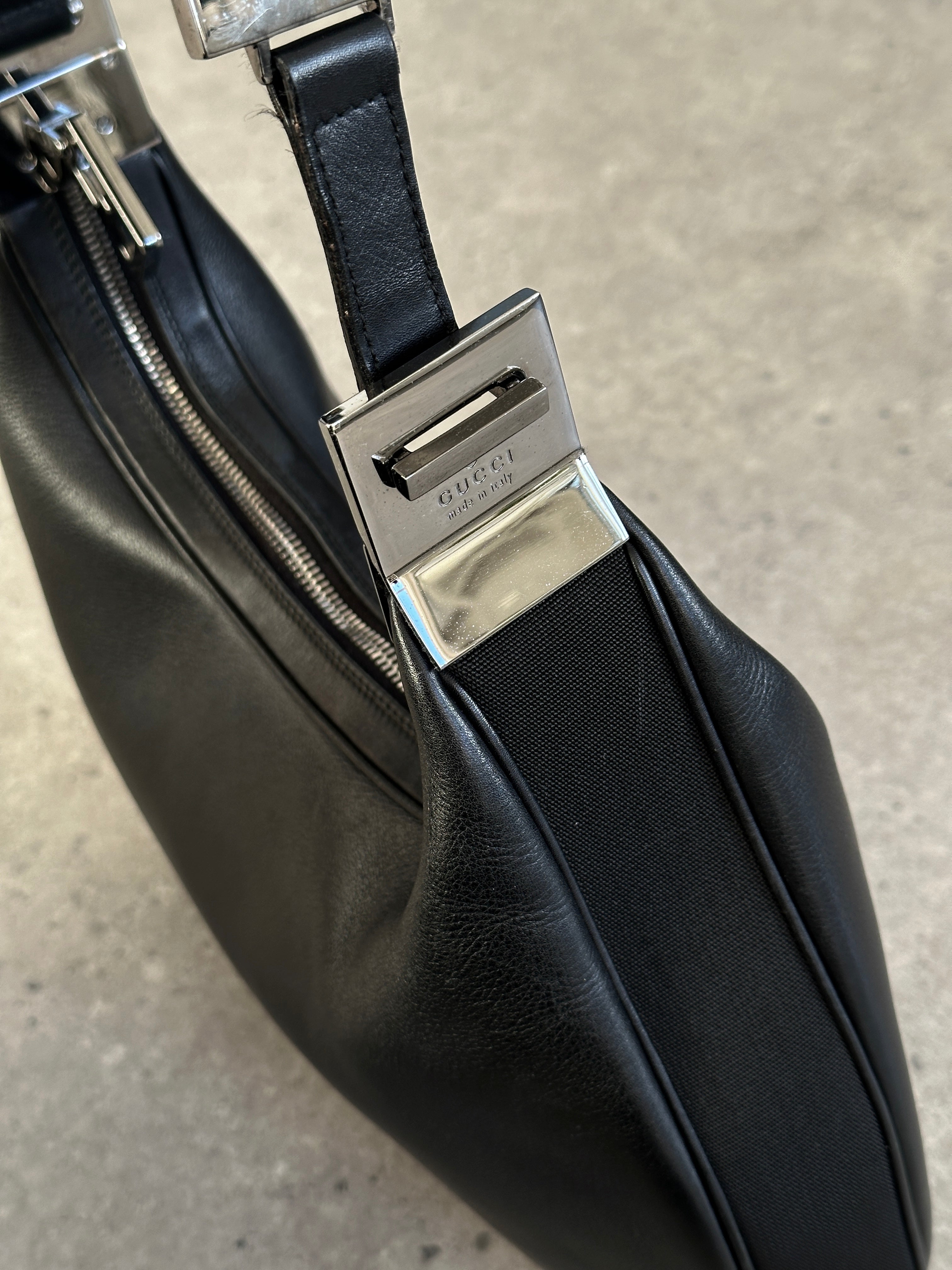 Gucci 1990s Tom Ford GG 3-in-1 leather attache bag with multiple compartments and classic design.