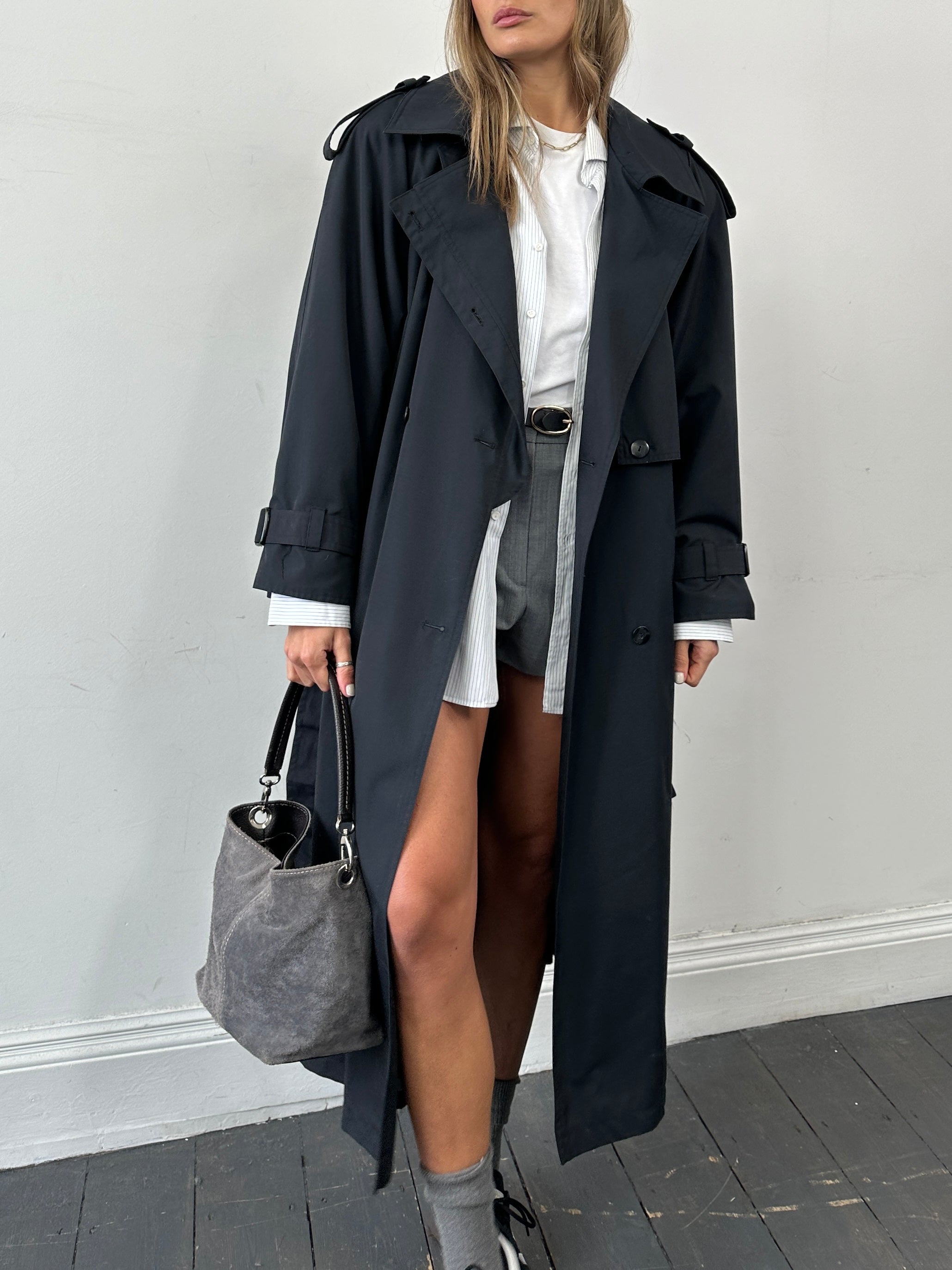 Vintage double-breasted floor-length belted trench coat in size XL, showcasing classic style and timeless design.