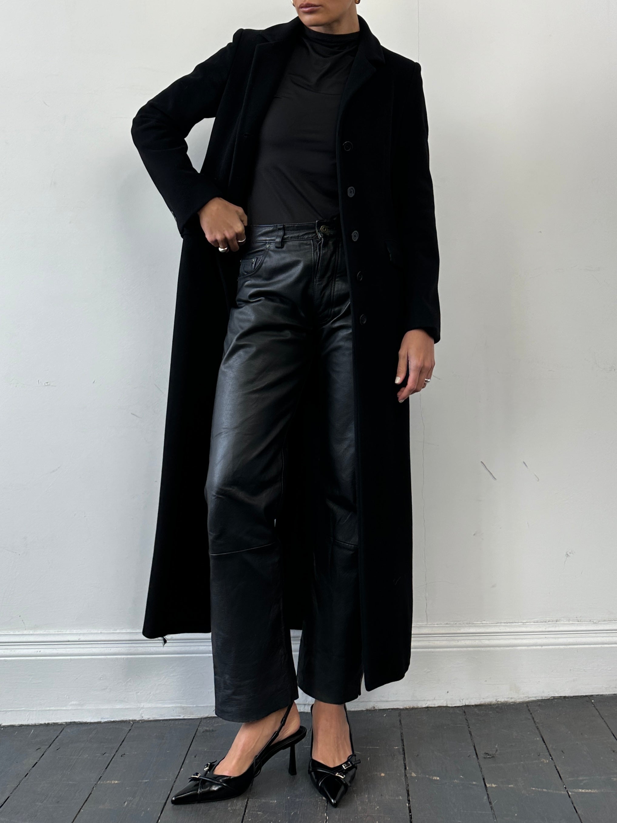 Vintage straight leg leather trousers in size W30, showcasing classic design and rich leather texture.