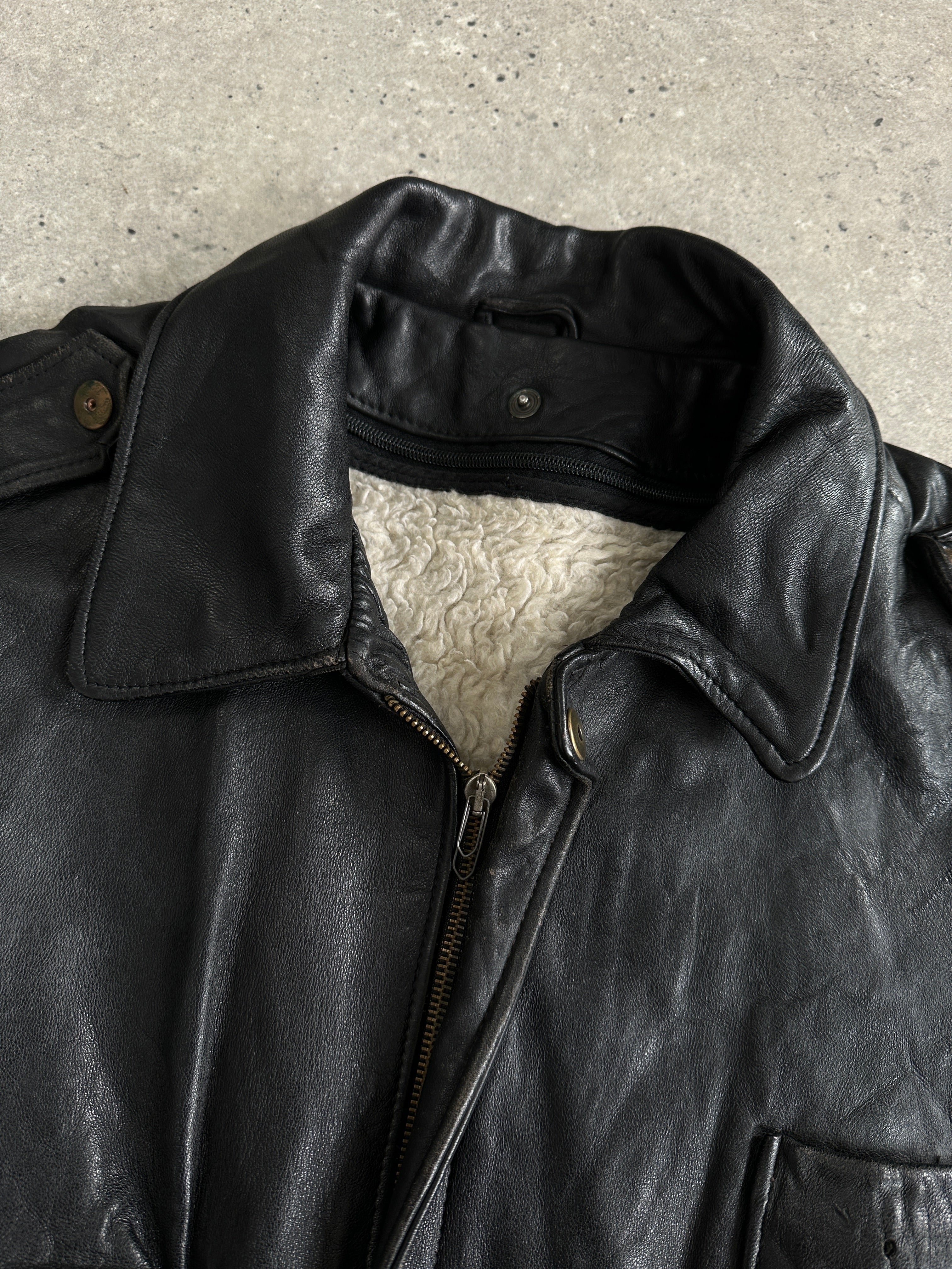 Vintage Italian leather bomber jacket with removable fleece lining, size large, stylish and warm, featuring classic design details.
