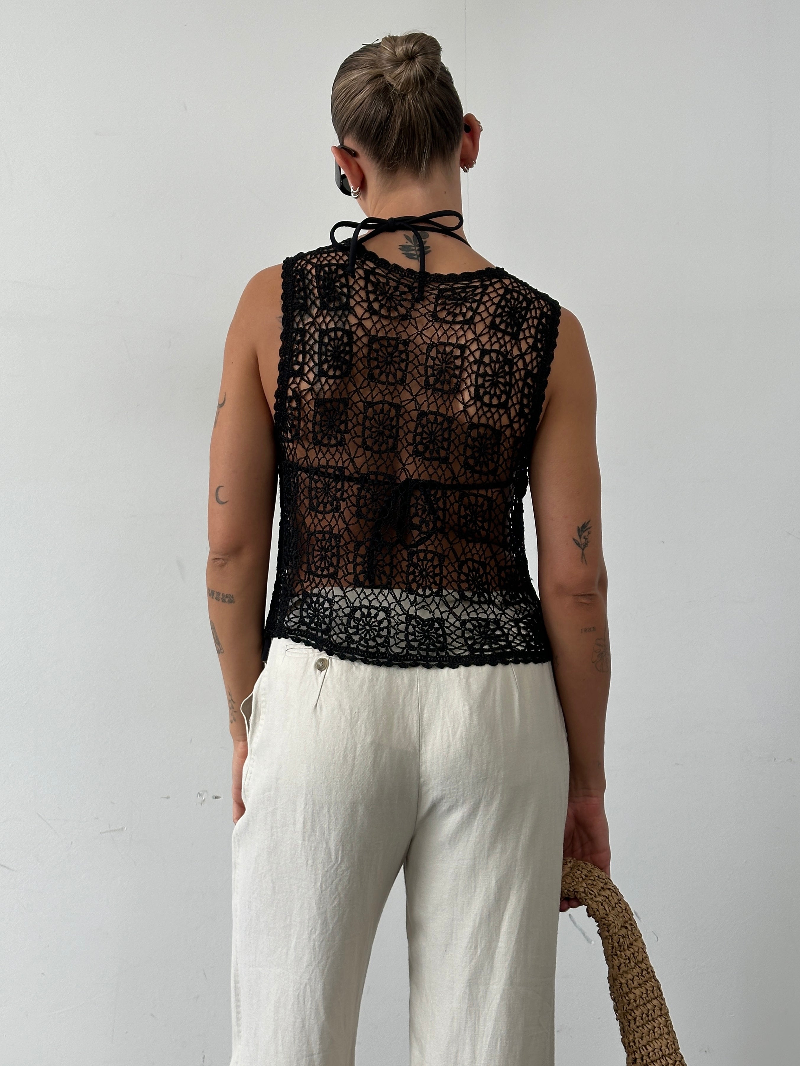 Vintage brand vintage crochet waistcoat in size M, featuring intricate crochet pattern and classic design for stylish layered look.