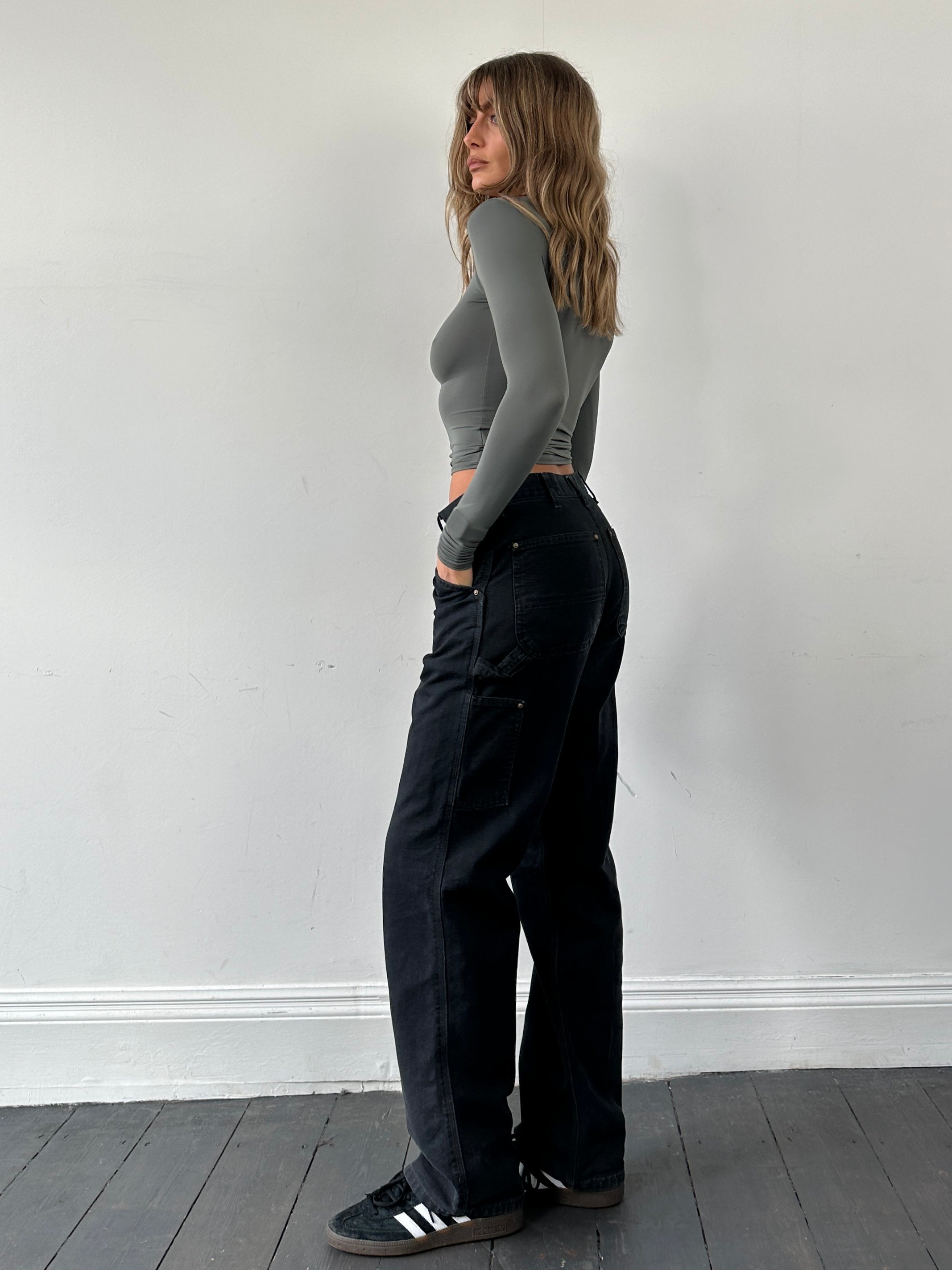 Carhartt high waisted cargo denim jeans in W30 with multiple pockets and classic blue wash, stylish and durable workwear pants.