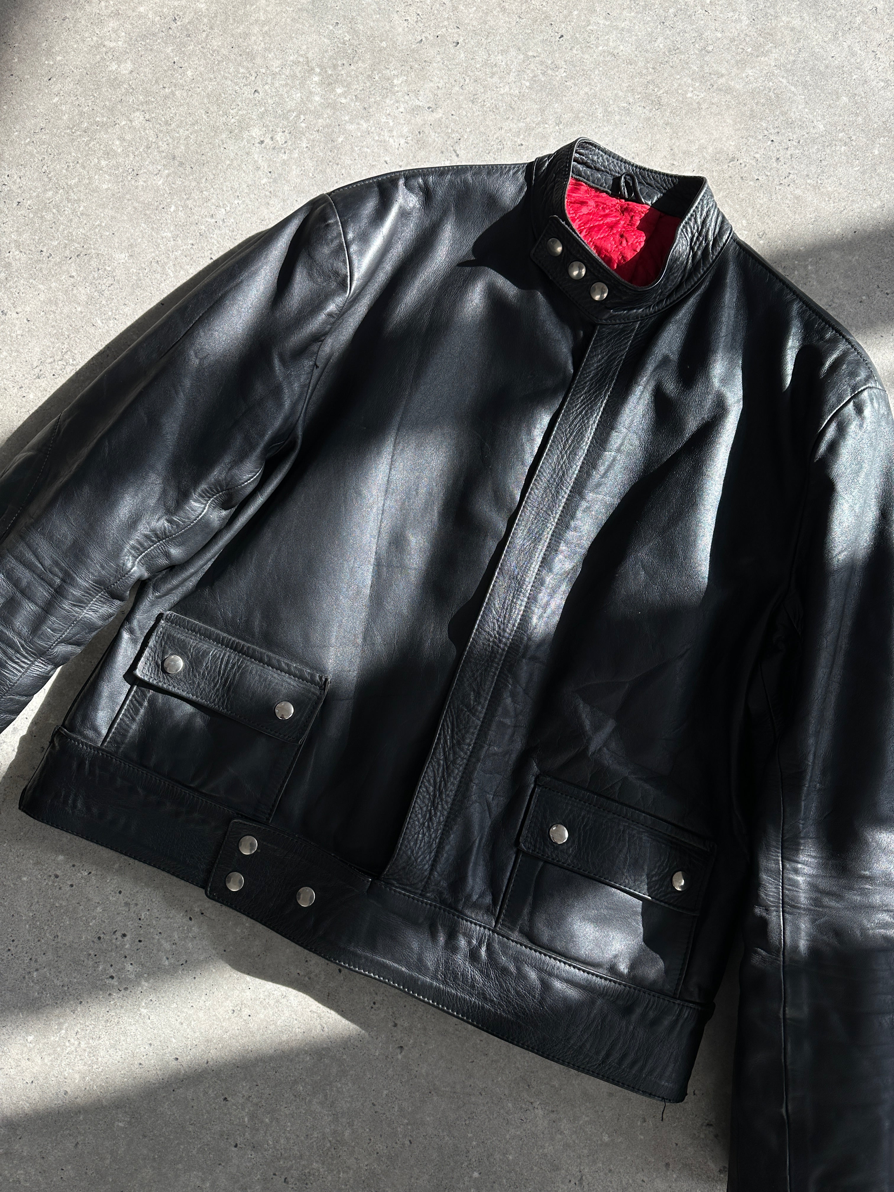 Vintage leather moto jacket in size large, featuring classic design and detailed stitching.