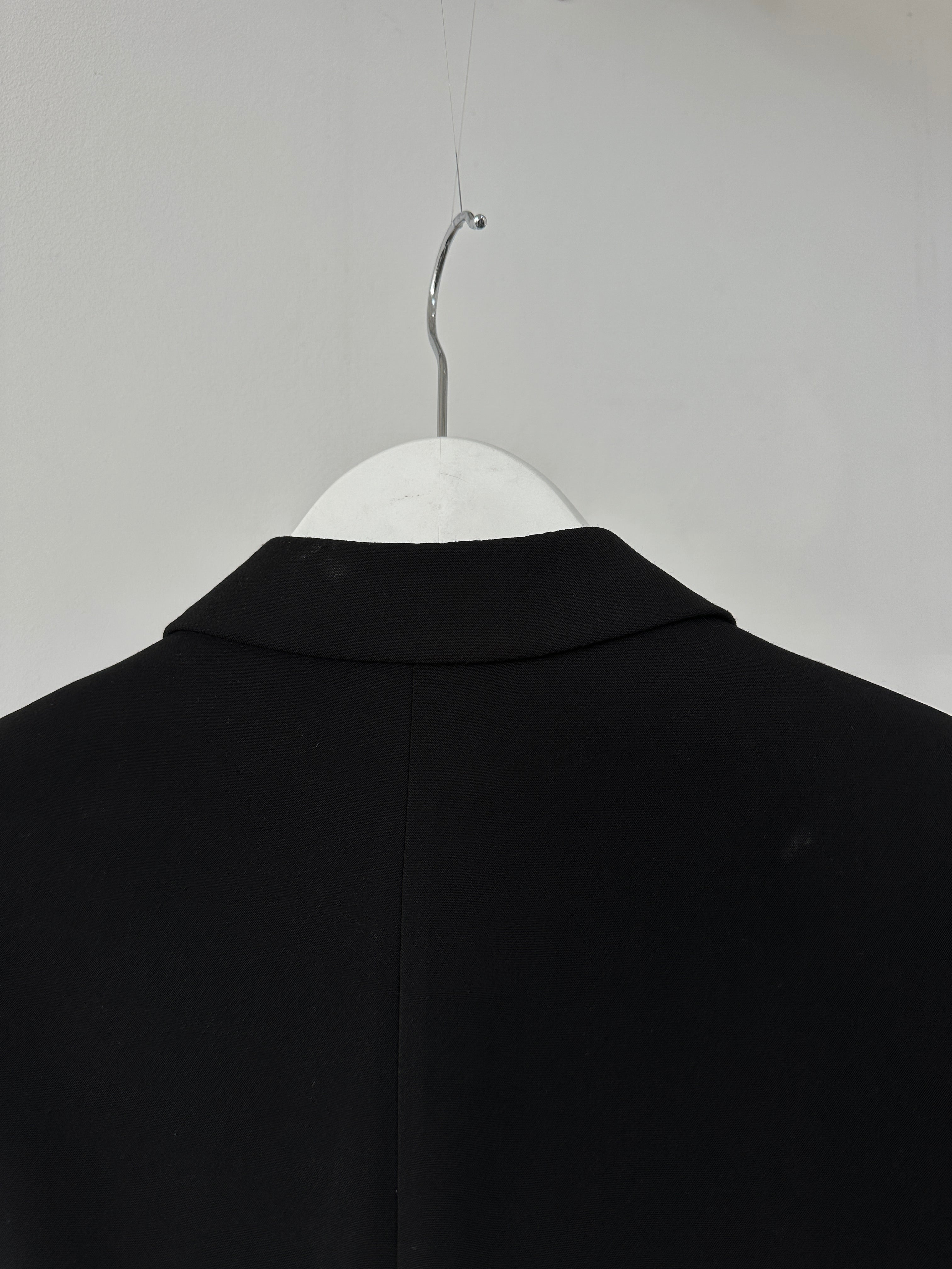 Vintage single-breasted three-piece suit in size 36R/W28, tailored fit with classic lapels and matching vest, styled for formal occasions.