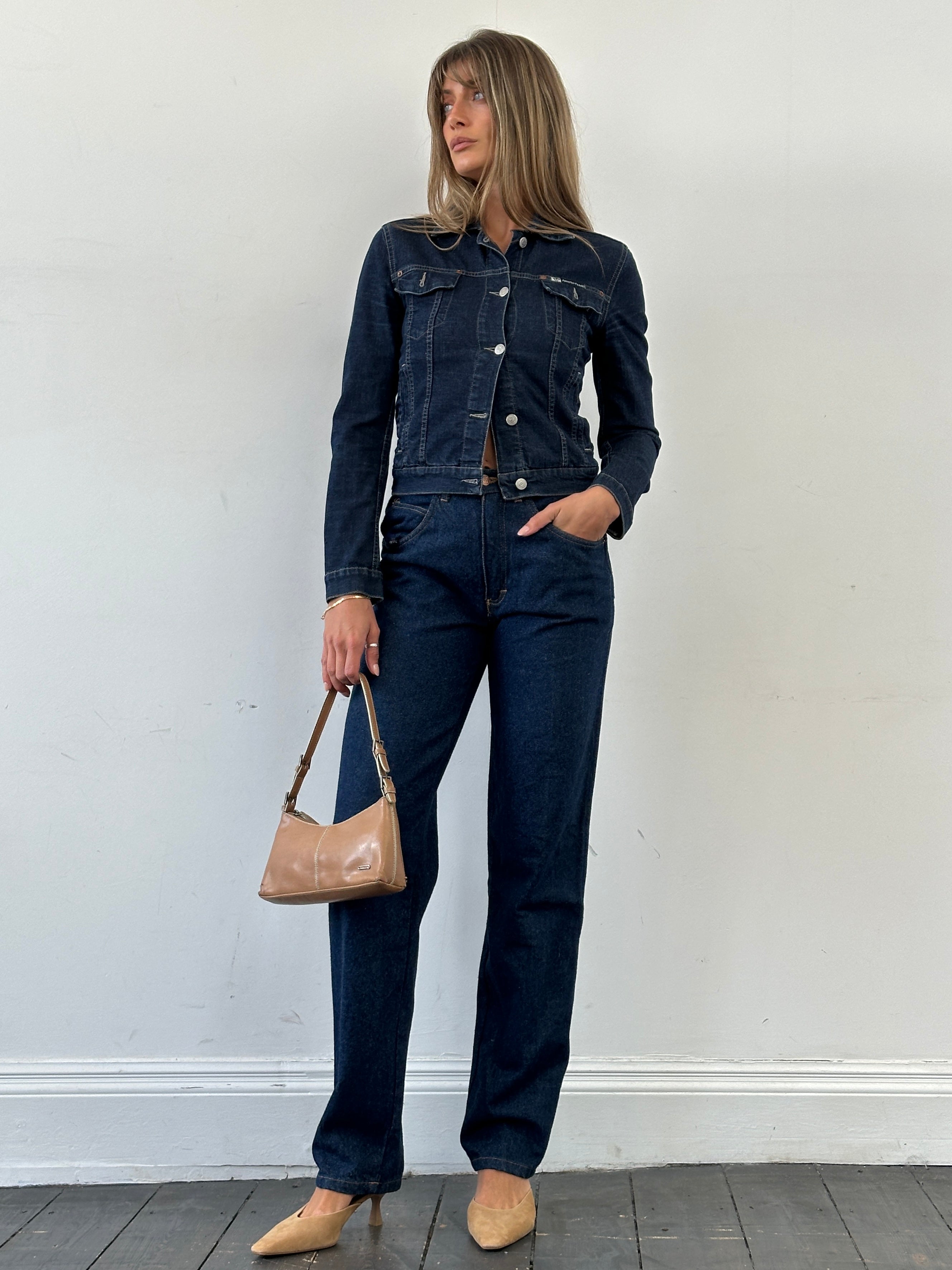 Vintage high waisted straight leg denim jeans with W26 fit, showcasing classic blue denim fabric and structured waistband.