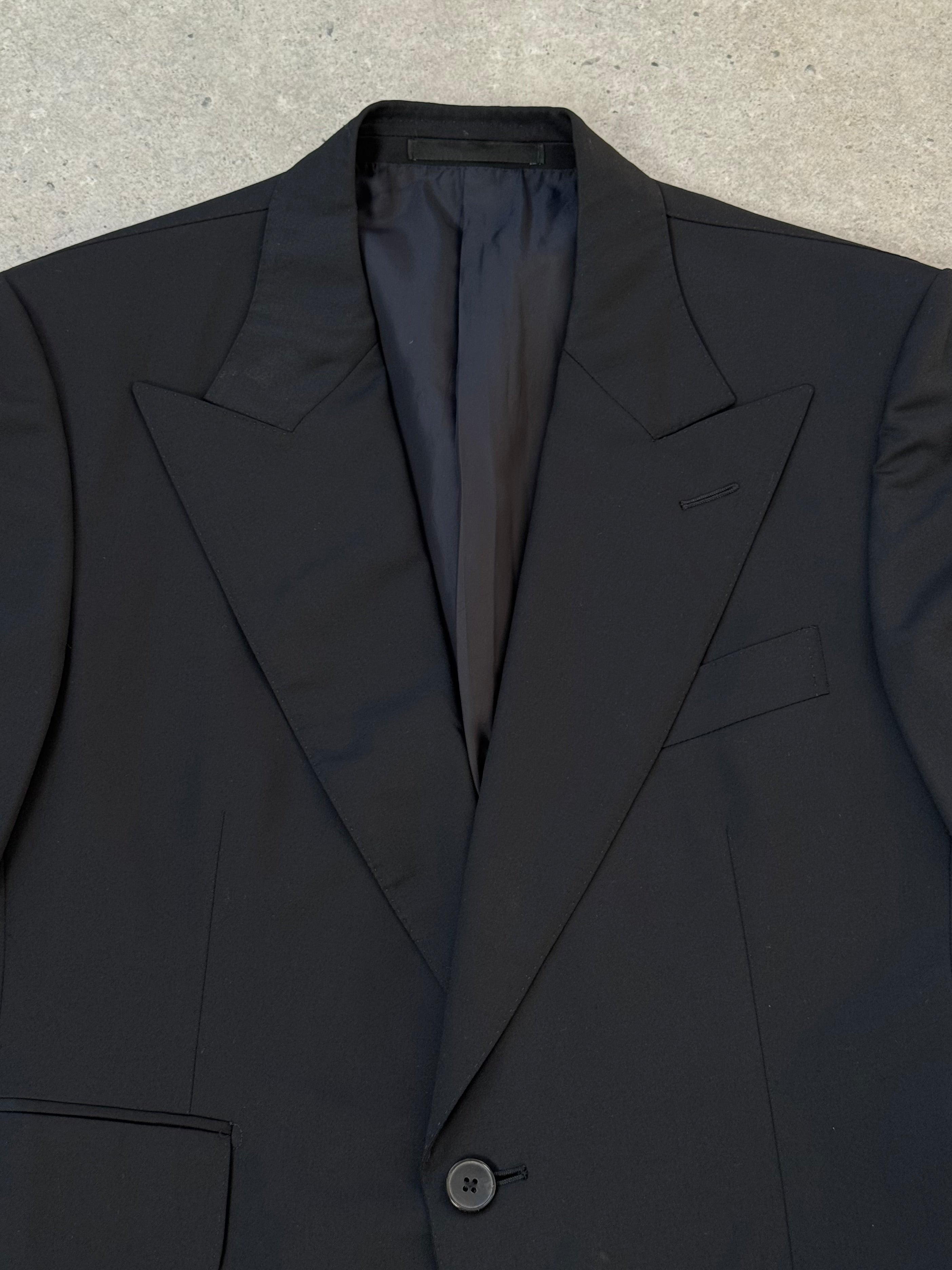 Gucci 1990s pure wool blazer with dagger collar, 38R/M size, featuring classic tailored design and dark navy color.