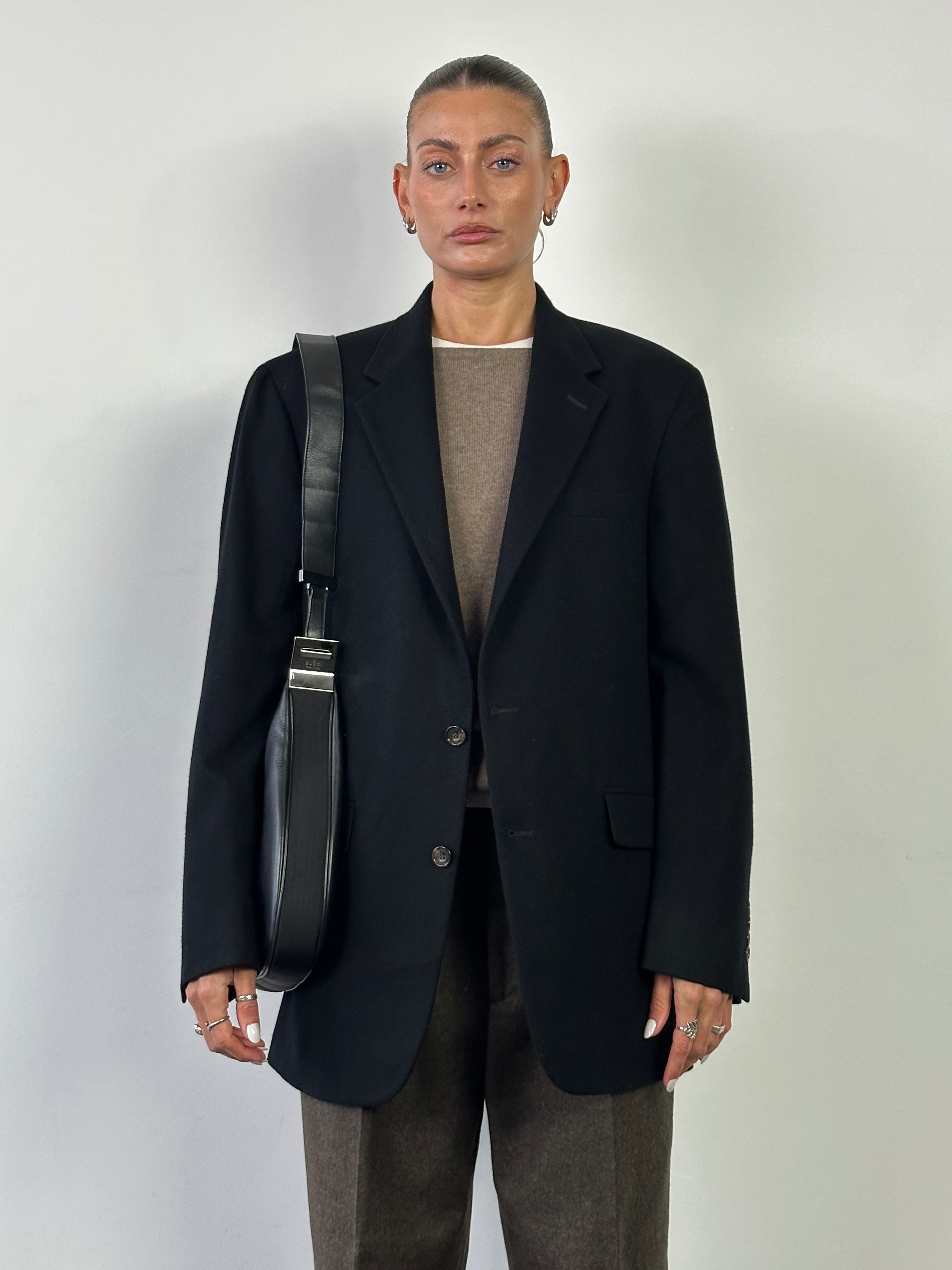 Gucci 1990s Tom Ford GG 3-in-1 leather attache bag with multiple compartments and a sleek design.