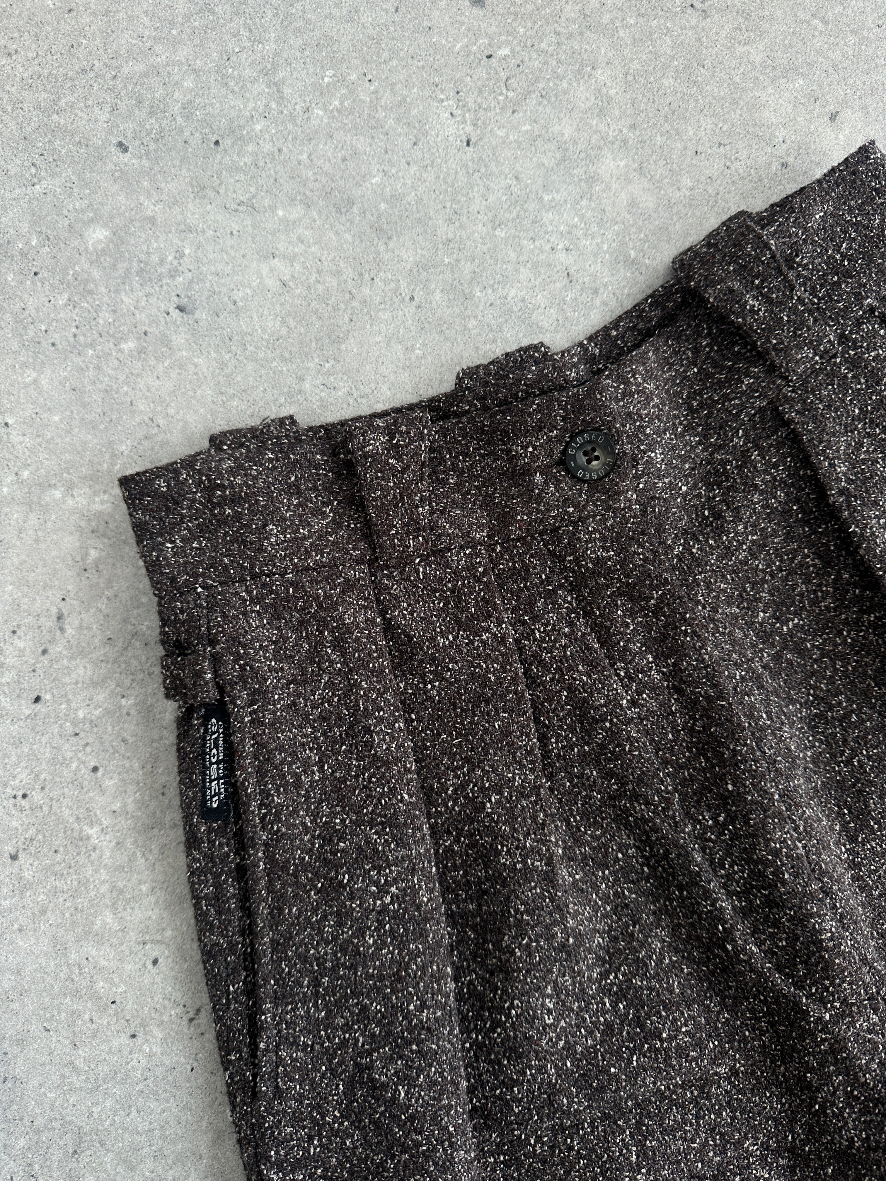 Vintage 1990s high-waisted wide-leg trousers in dark fabric, front view, showcasing classic retro style and fit.
