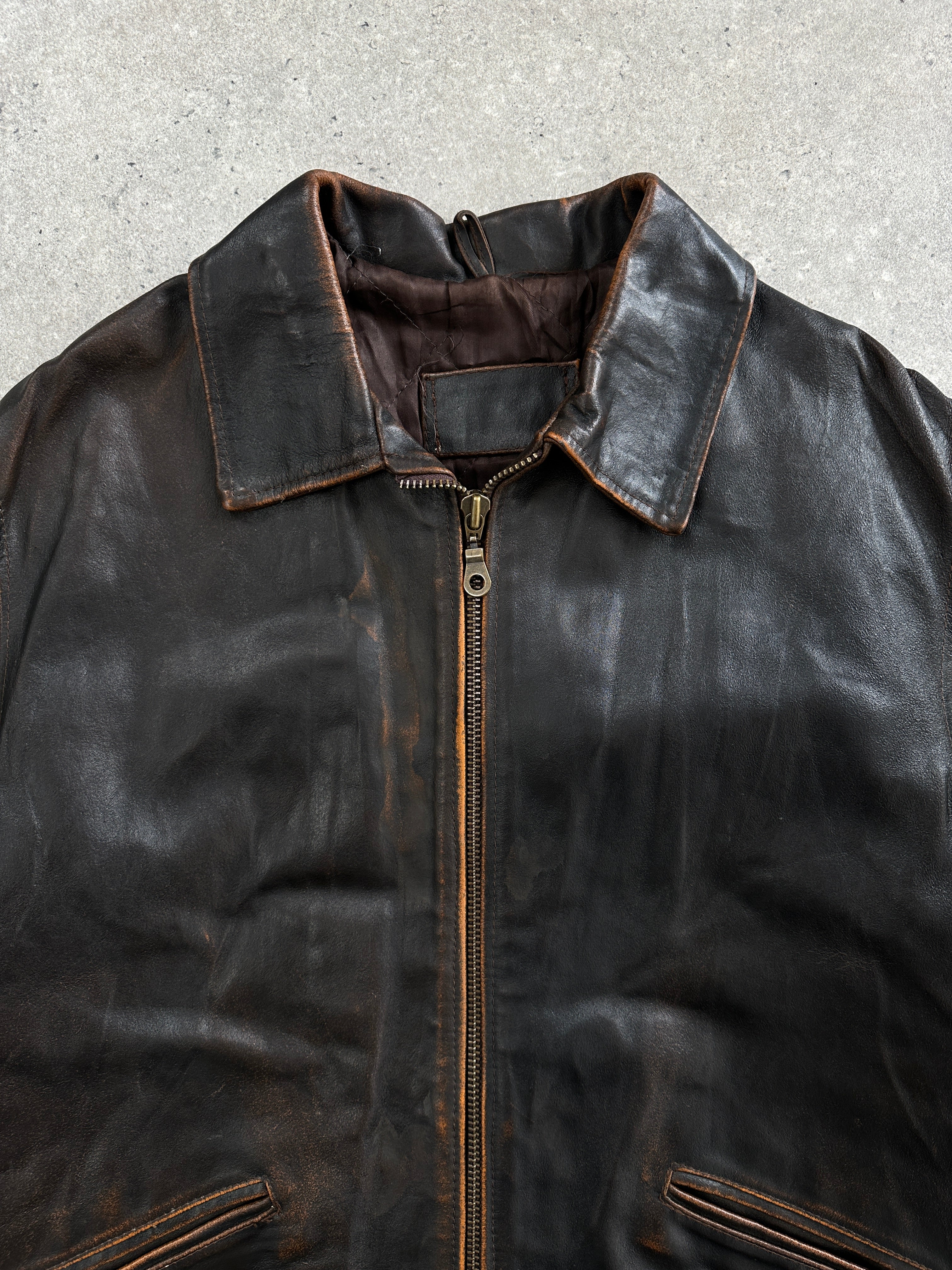 Vintage Italian distressed leather jacket from the 1990s, large/extra-large size, showcasing rugged leather and vintage style details.