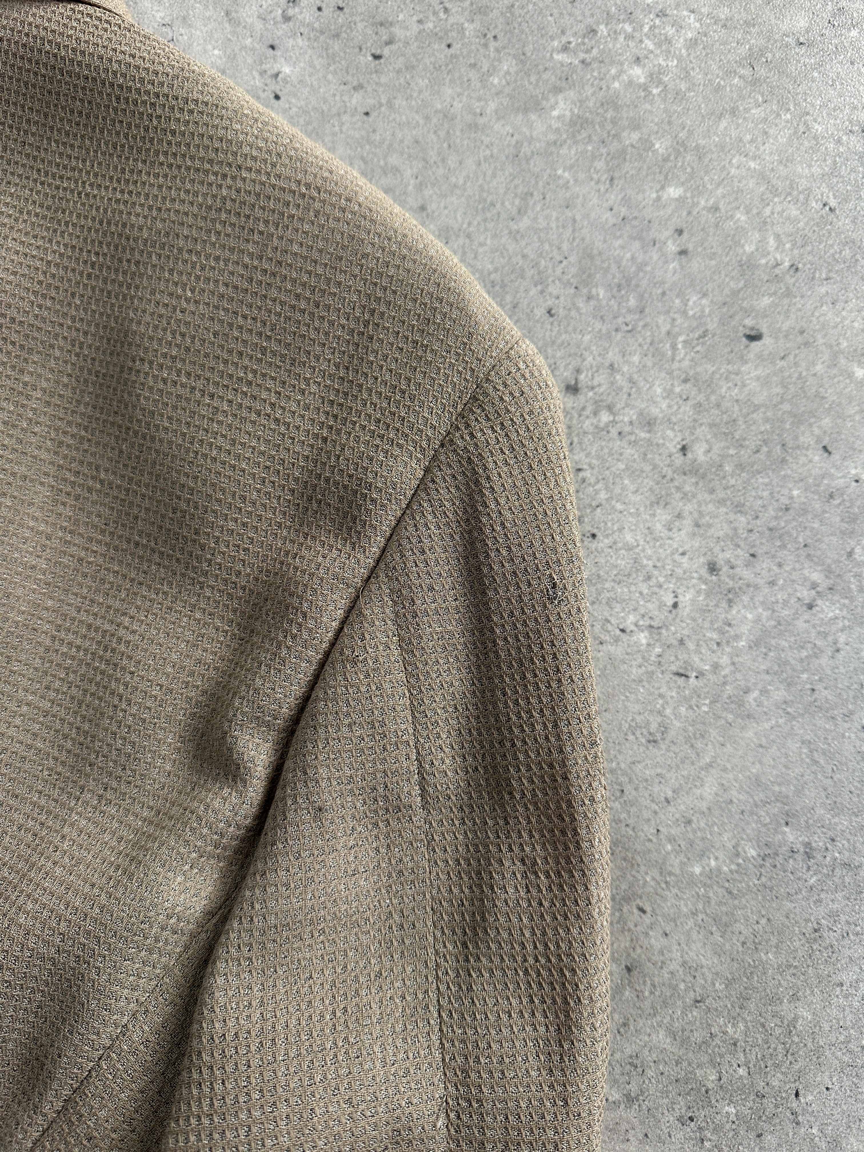 Giorgio Armani Le Collezioni 1990s wool woven blazer in size 40R/L, tailored fit with classic lapel and textured fabric.