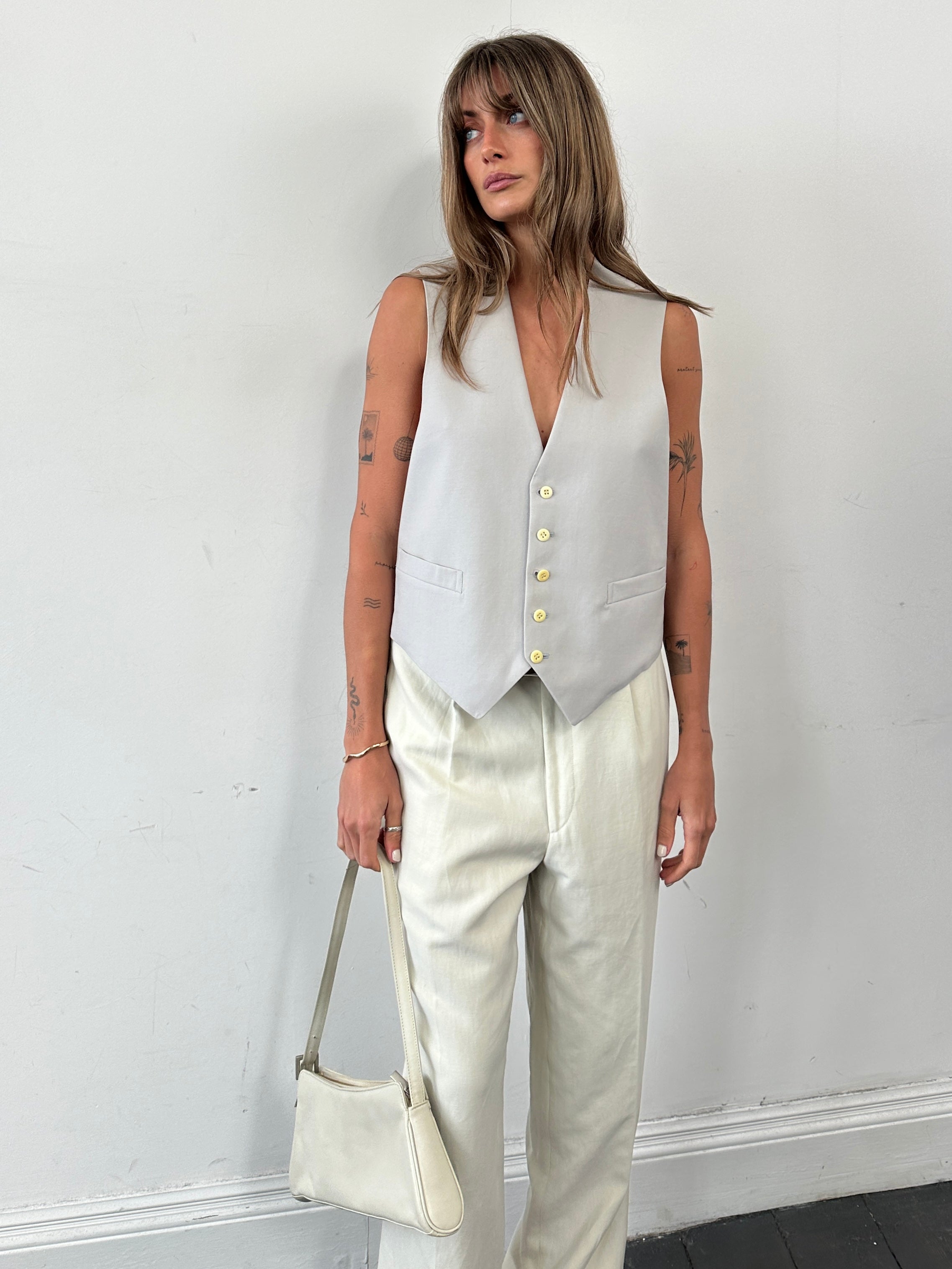 Vintage pure wool tailored waistcoat in M/L size, featuring classic design and high-quality fabric, perfect for smart casual wear.