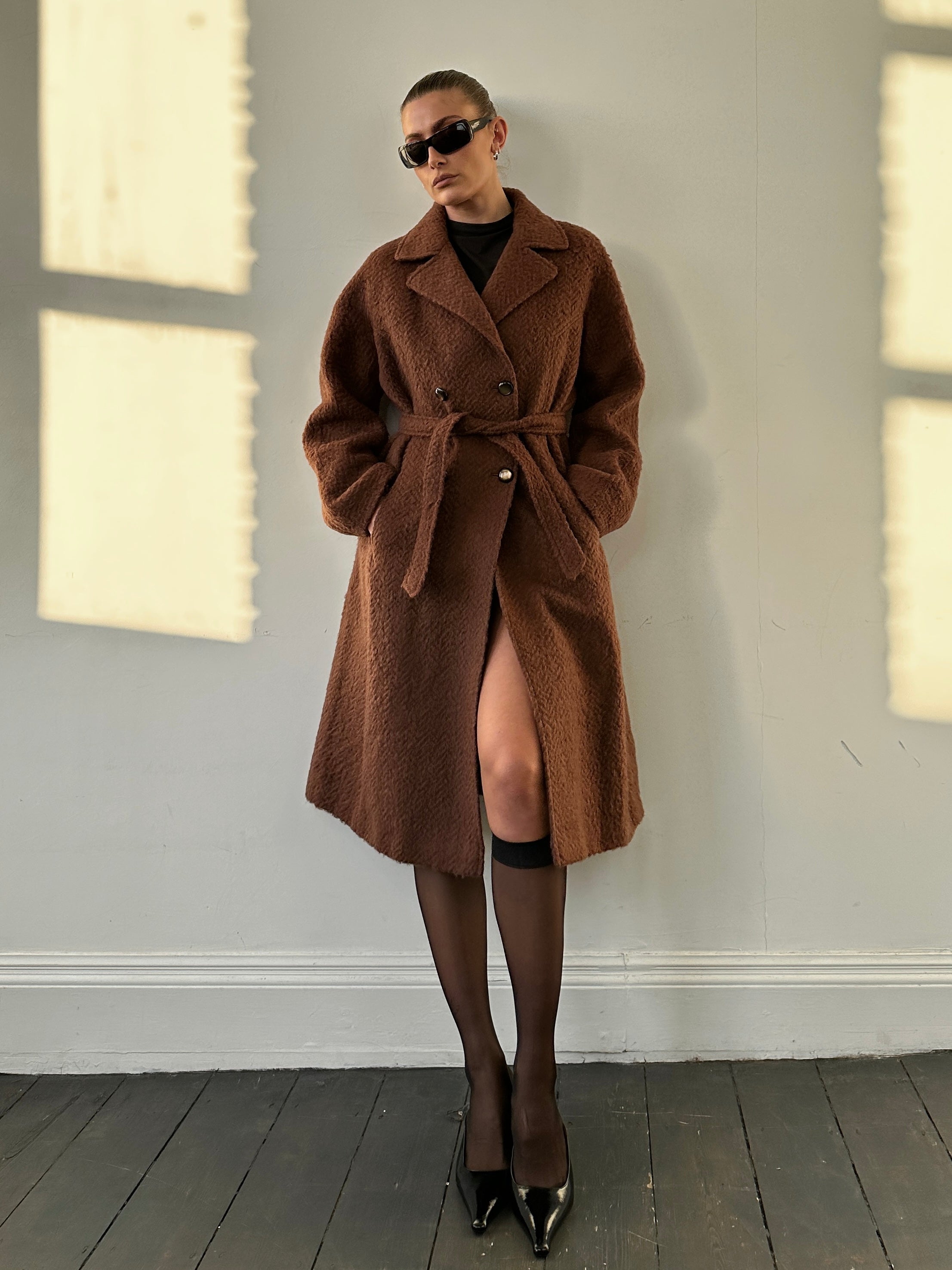 Vintage Italian mohair wool double-breasted belted coat in S/M, featuring classic design and warm, luxurious fabric.