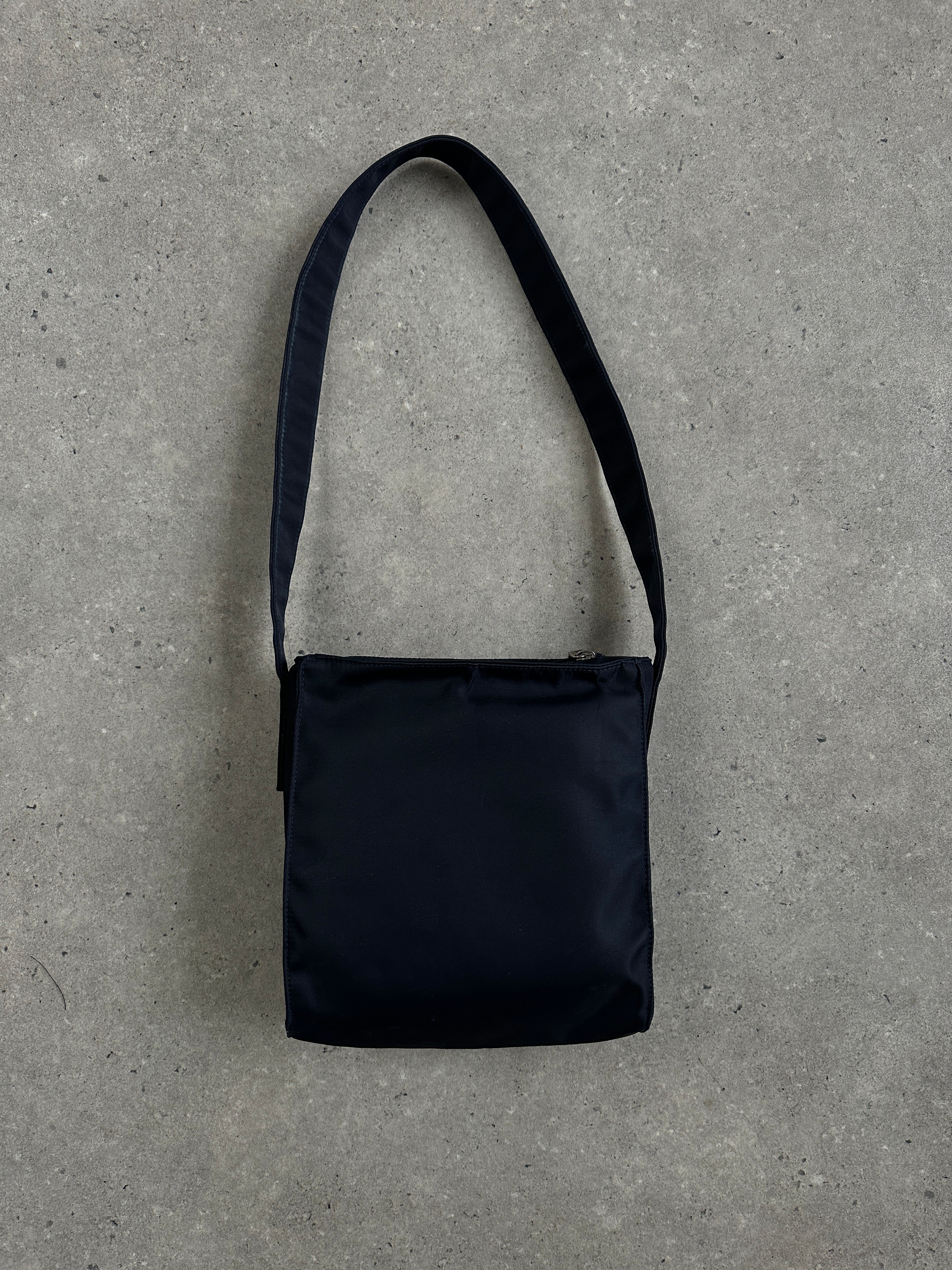 Armani Jeans 2000s nylon shoulder bag with adjustable strap and sleek design, showcasing the classic brand logo.