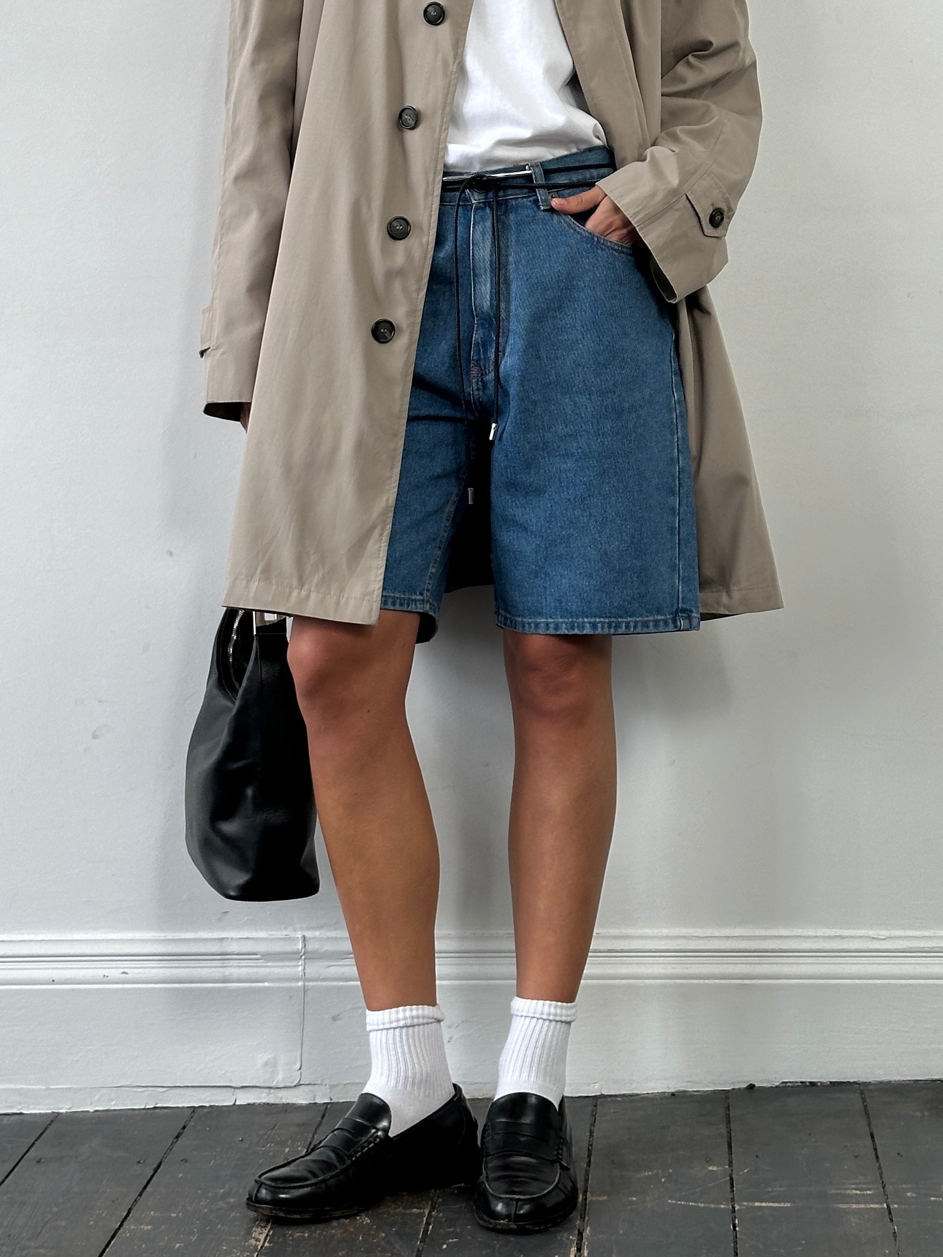 Calvin Klein CK loose leg denim shorts in W32, featuring a classic blue wash and casual fit, displayed on a neutral background.