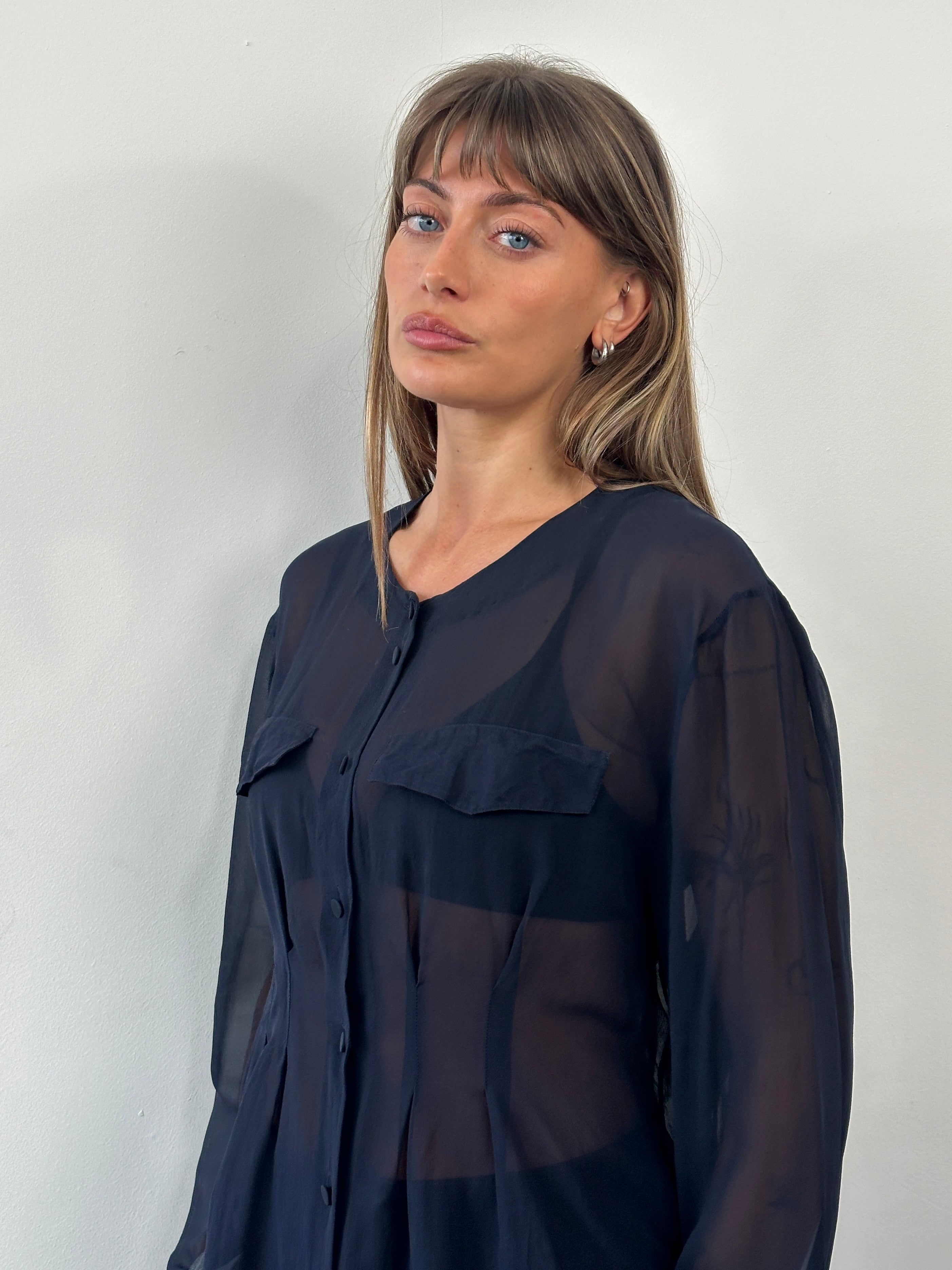Vintage 1990s pure silk sheer shirt in size M, featuring lightweight, flowy fabric and classic design with long sleeves.