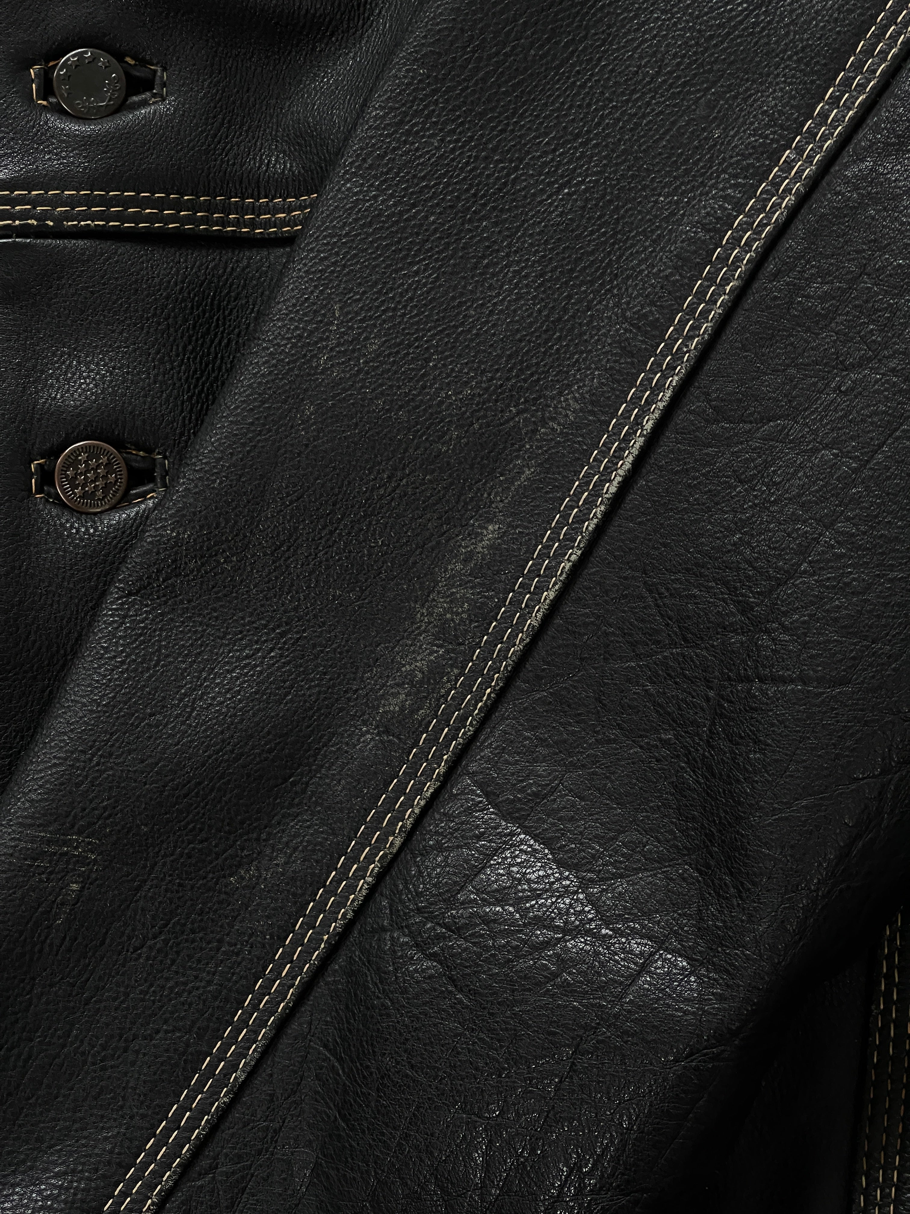 Vintage 1990s leather boxy jacket, M/L size, with classic design and textured leather finish.
