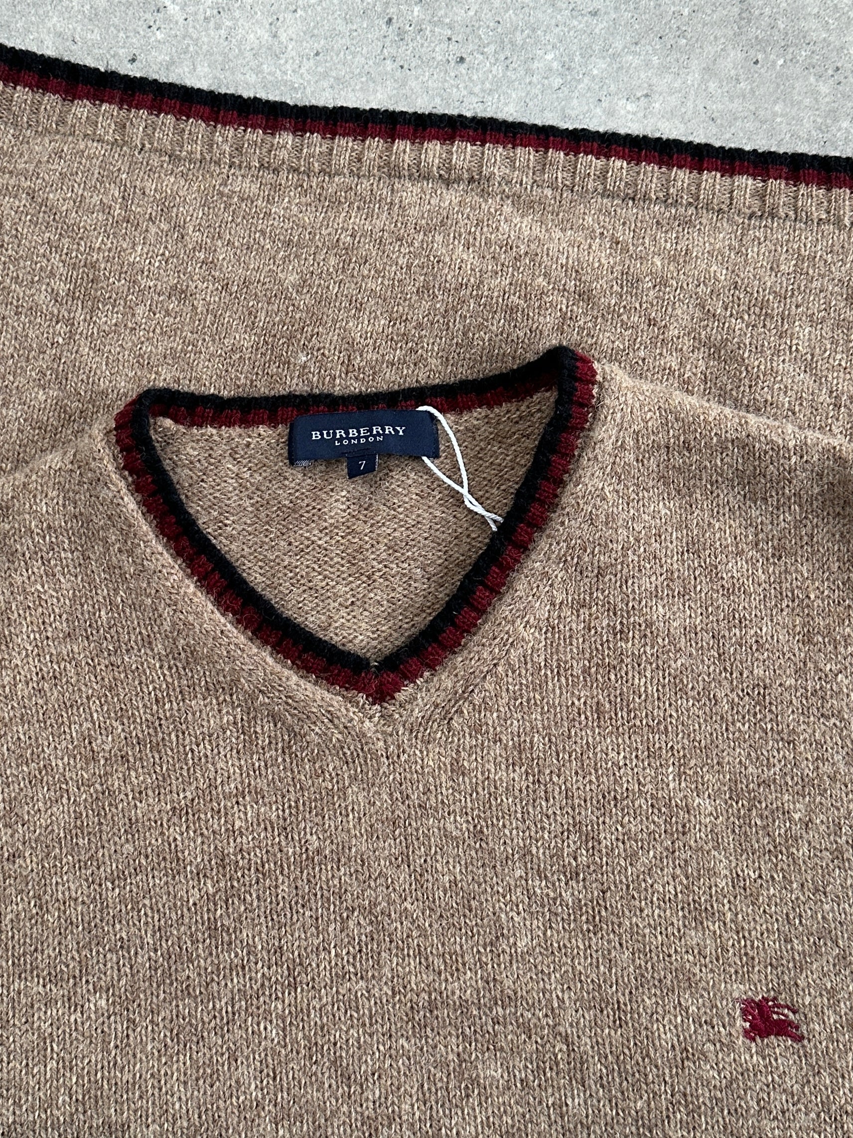 Burberry London 2000s pure wool sleeveless logo knitted jumper in black, showing the front view with logo details.