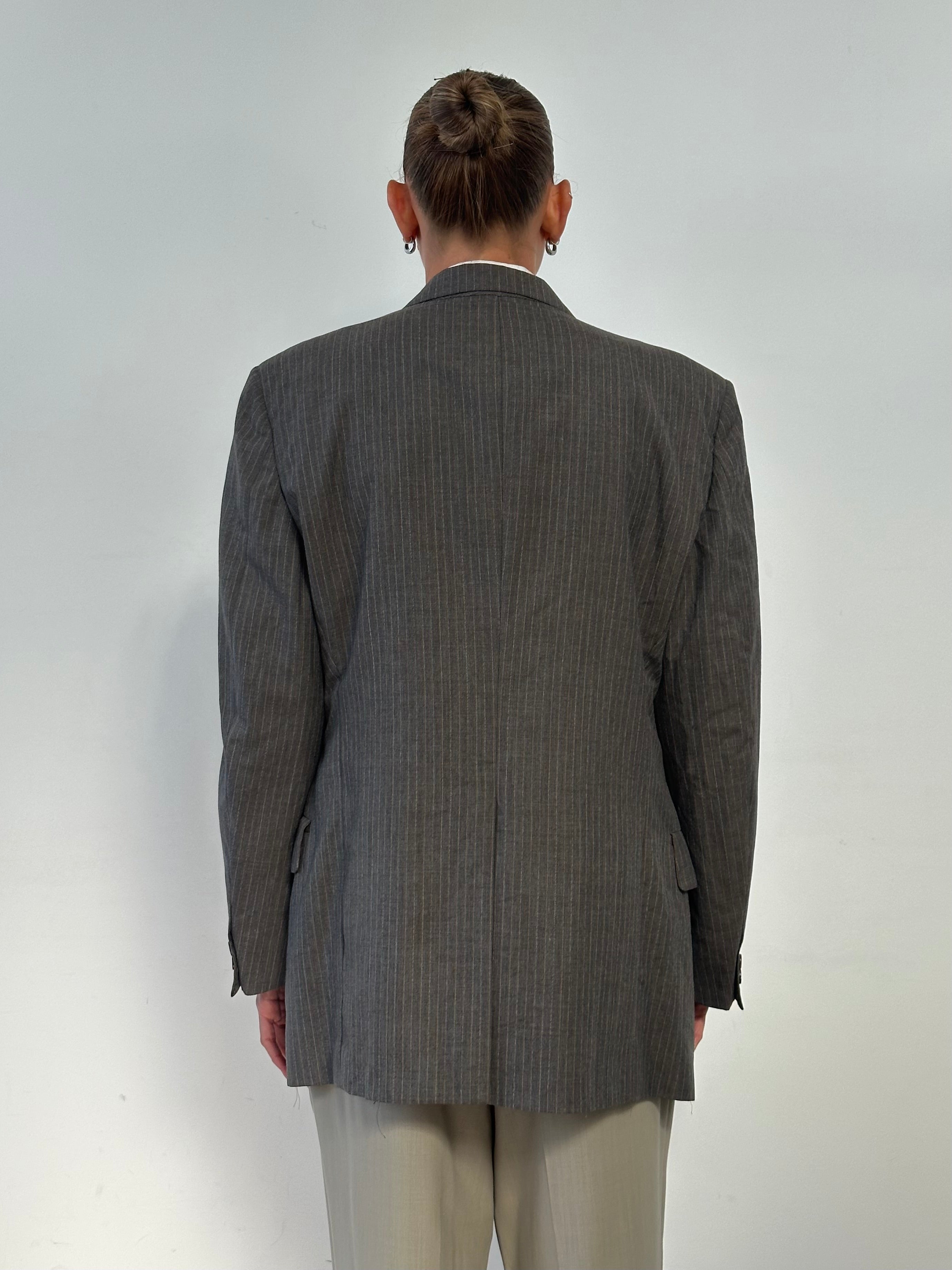 Christian Dior Monsieur 1990s striped wool blazer in size 40R/M, featuring classic tailored fit and bold stripe pattern.