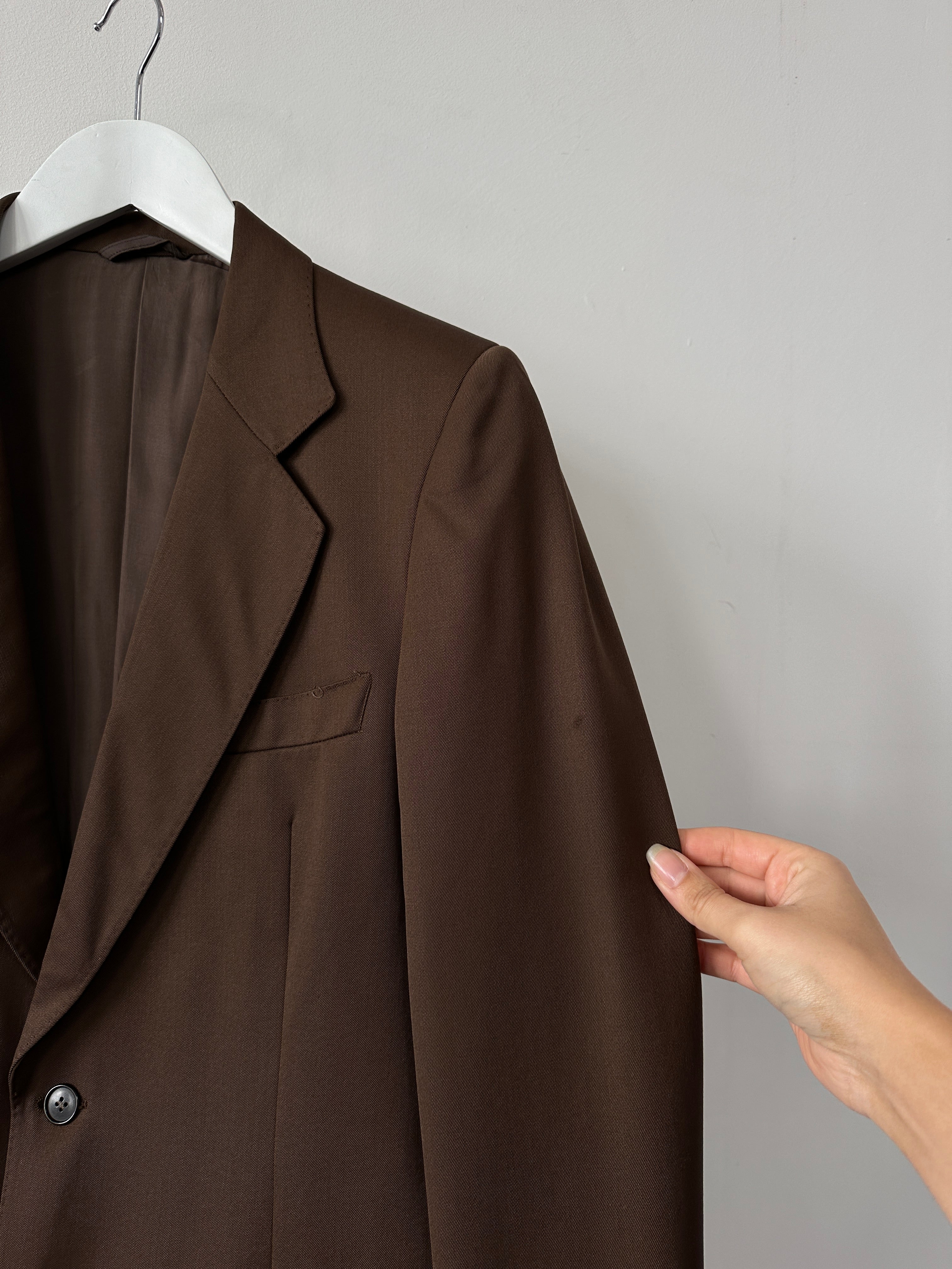 Vintage Italian vintage pure wool single-breasted blazer in size S/M, featuring classic tailored design and timeless style.