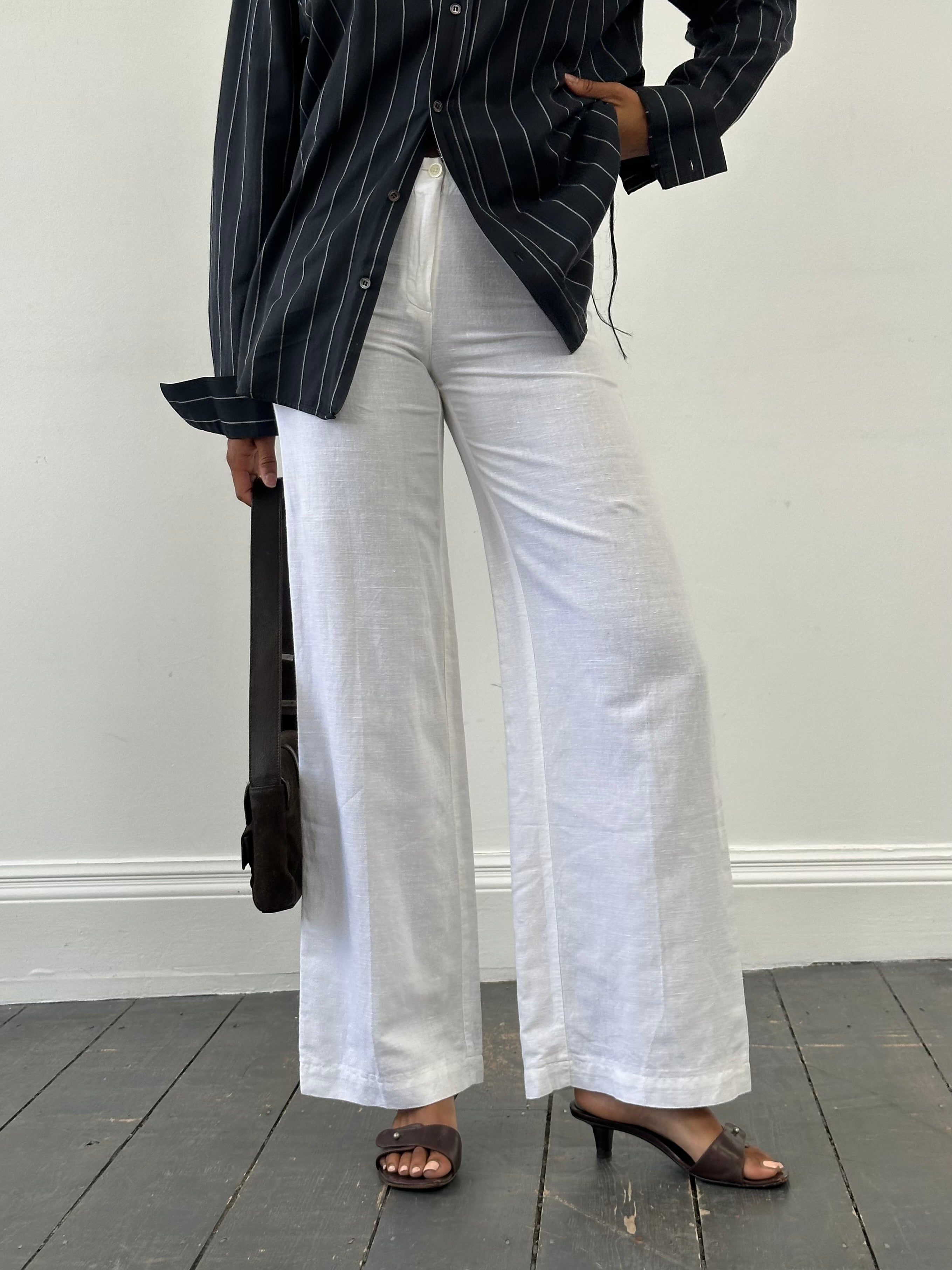 Vintage 1990s pure linen low waist wide-leg trousers in natural beige, size W24, casual retro style.