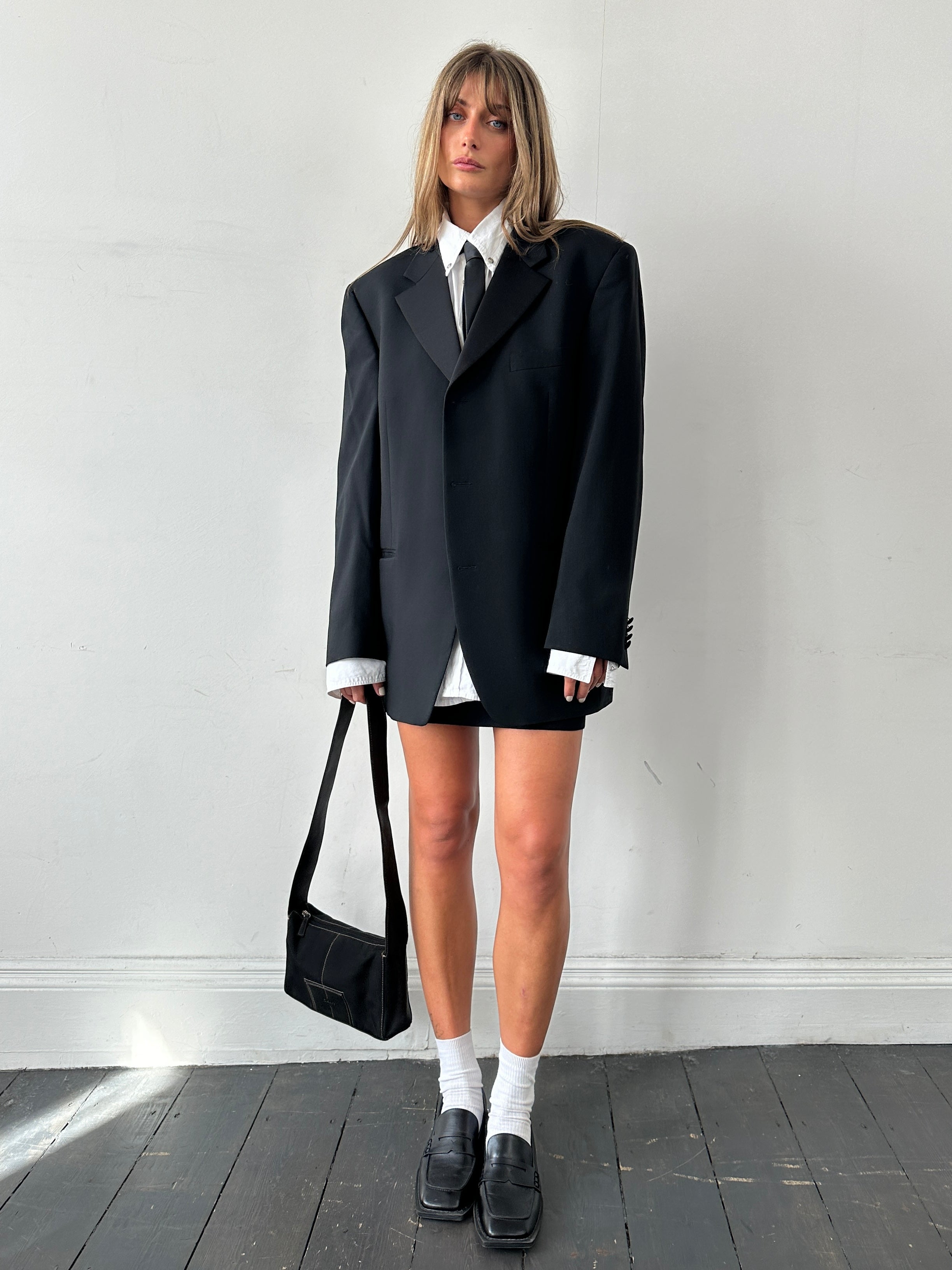 Vintage men's vintage tuxedo blazer in pure New Wool, single-breasted style, size 44R/XL, displayed on a hanger.