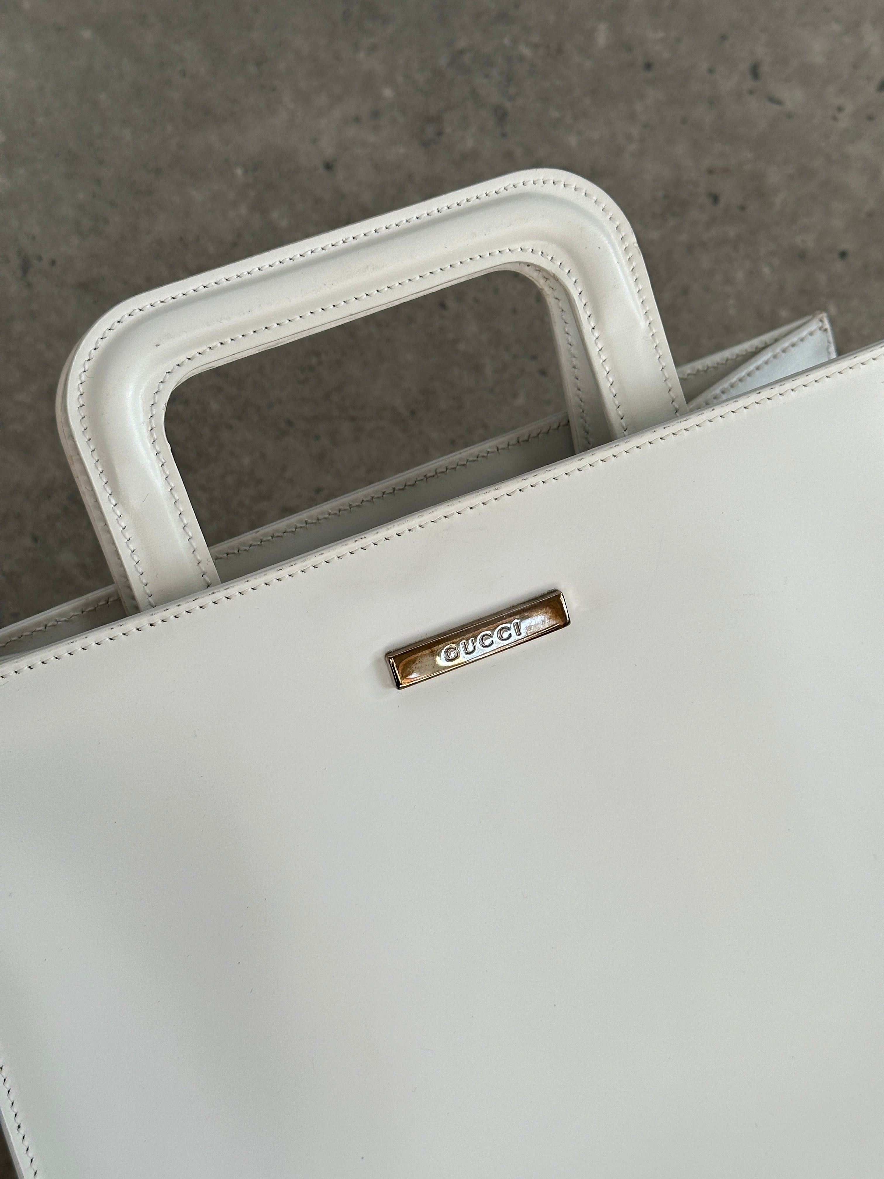 Gucci 1990s Tom Ford leather and vinyl 2-in-1 shoulder bag with chain strap and signature logo details.
