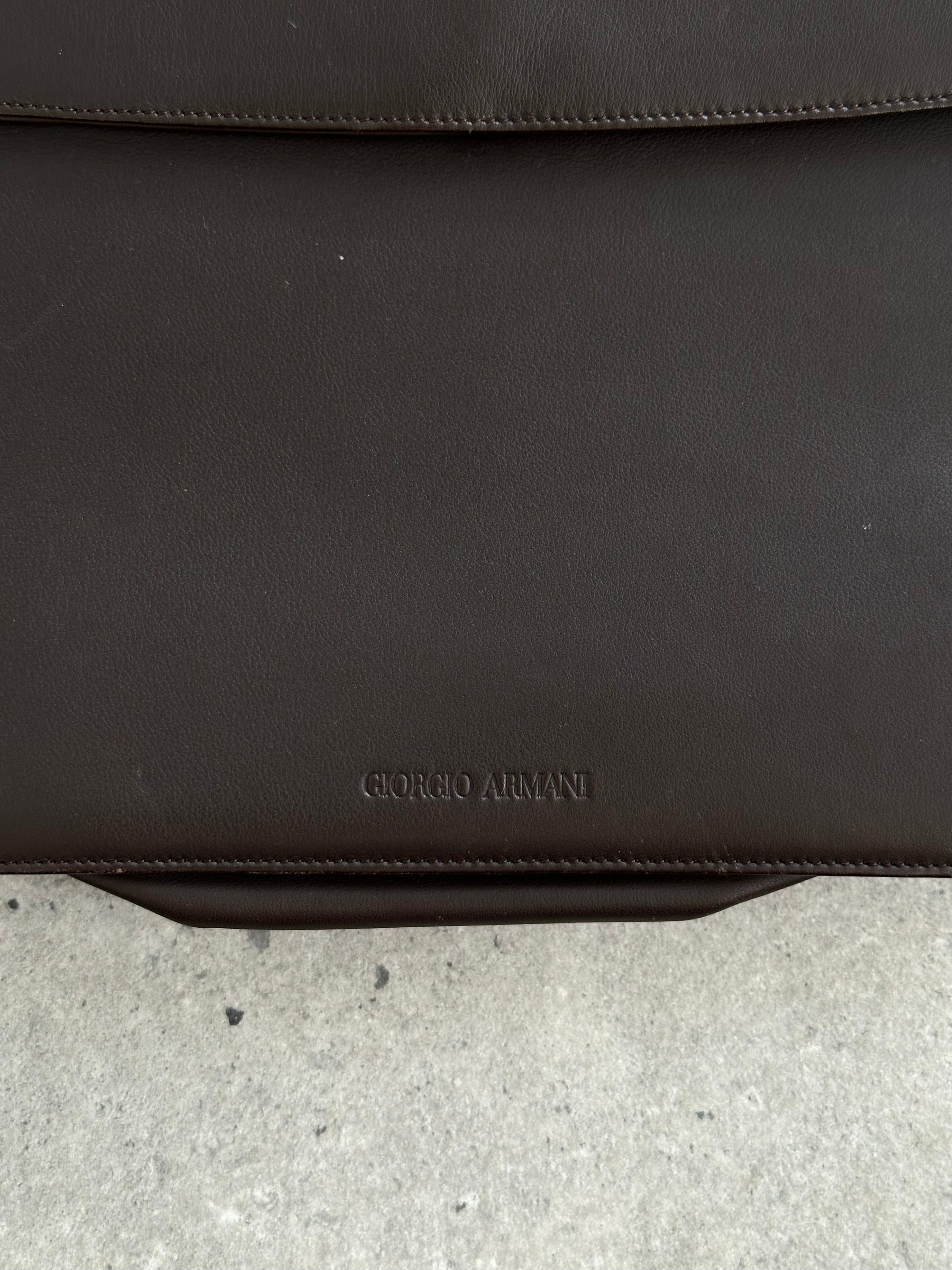 Giorgio Armani Le Collezioni leather shoulder bag with sleek design and subtle branding, featuring a polished shoulder strap.