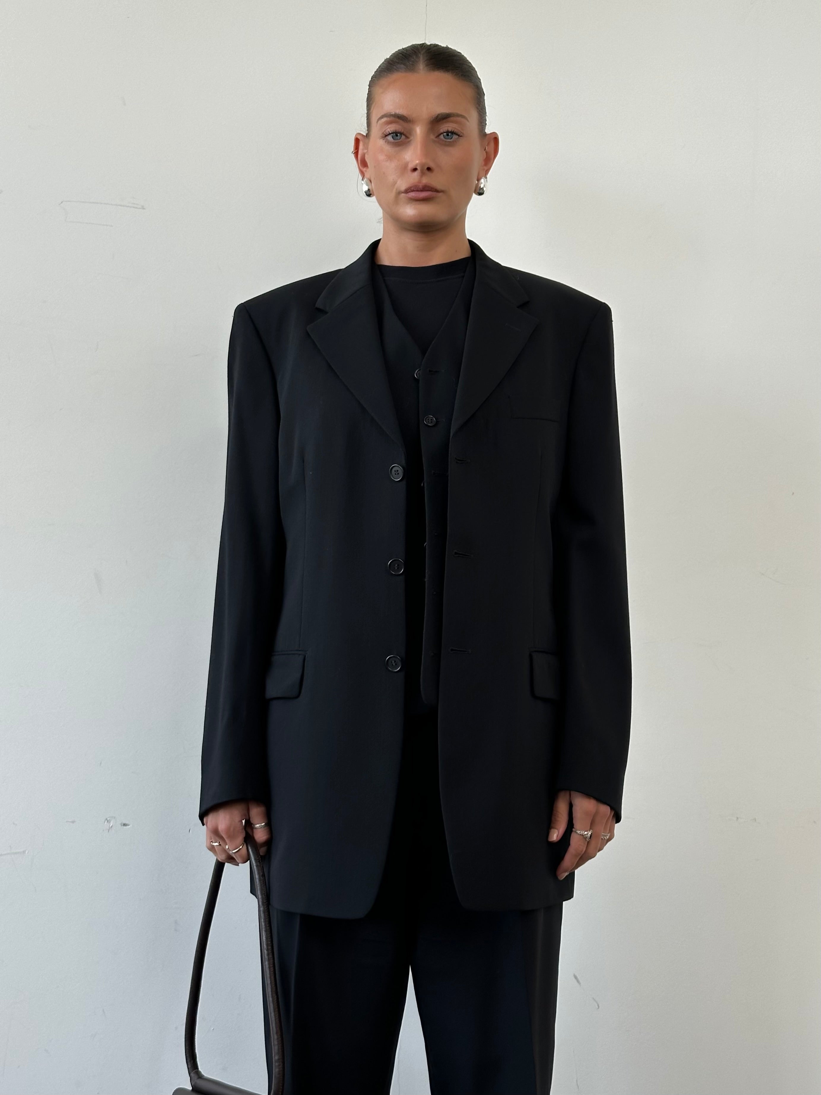 Yves Saint Laurent Pour Homme pure wool three-piece suit in size 40L/W32, featuring a tailored jacket, vest, and matching trousers.