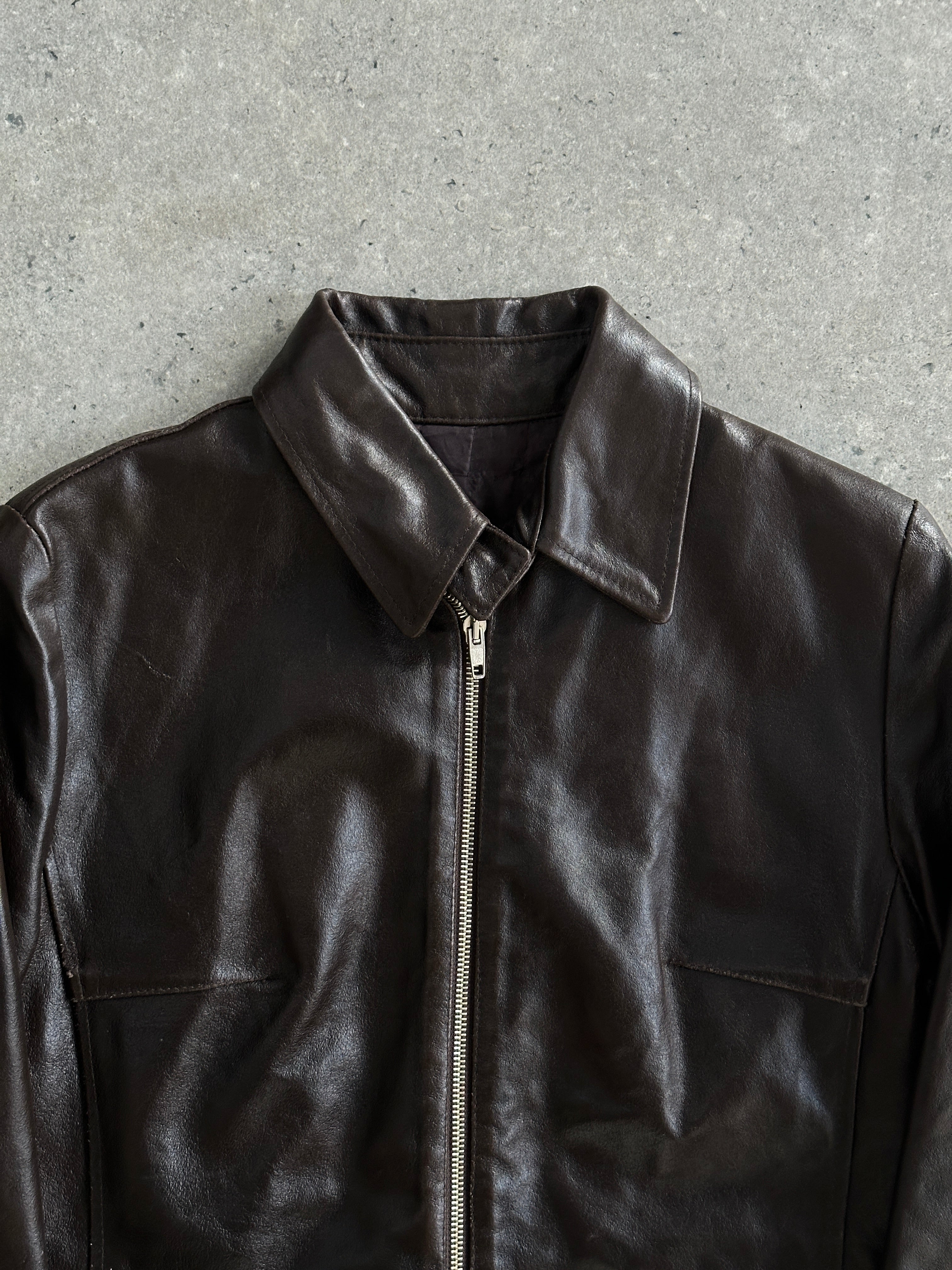 Vintage smooth leather jacket in size small featuring classic design and timeless style.
