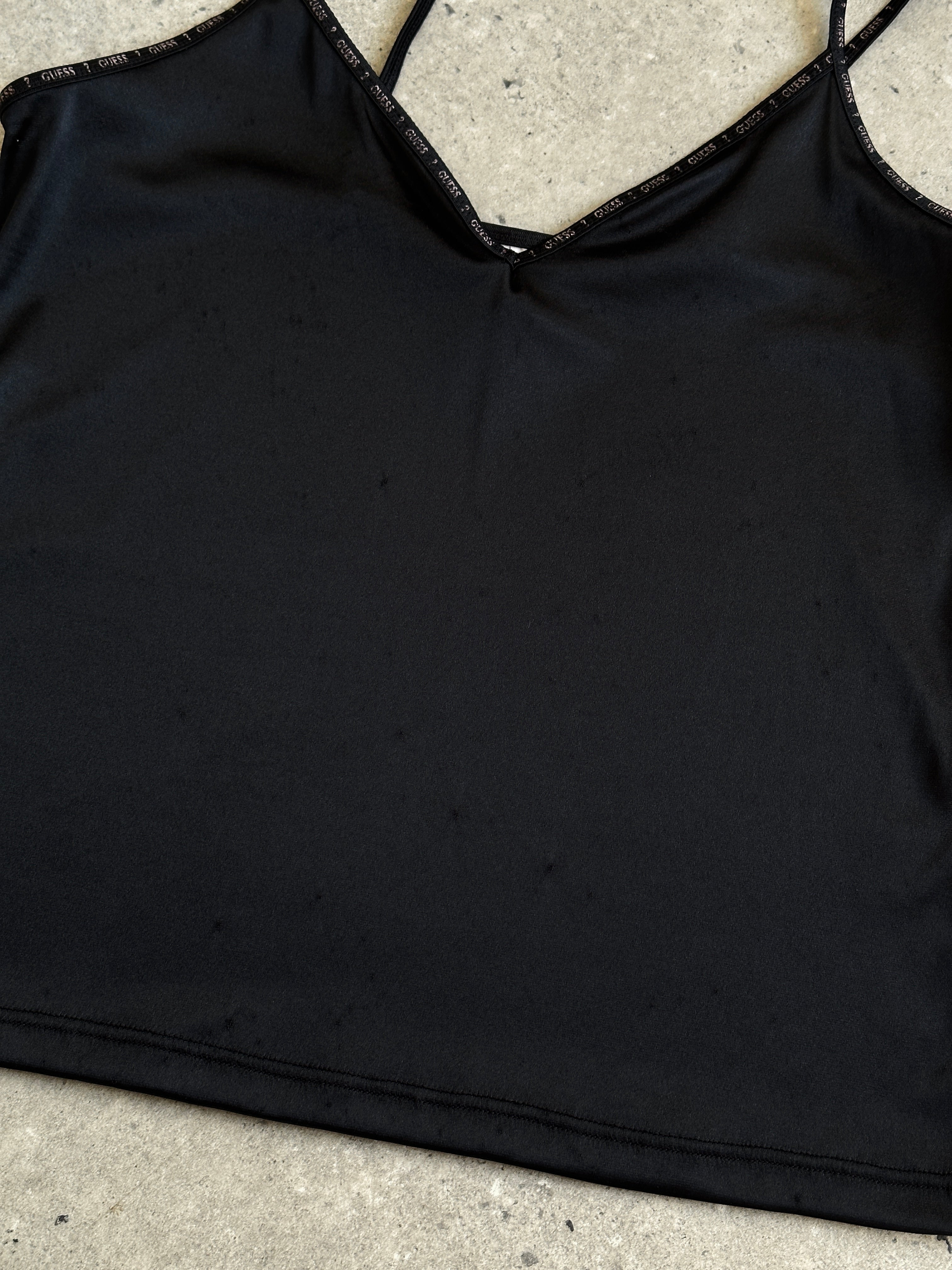 Guess stretch spaghetti cami top in black, featuring a fitted design and thin straps, perfect for casual or layered looks.