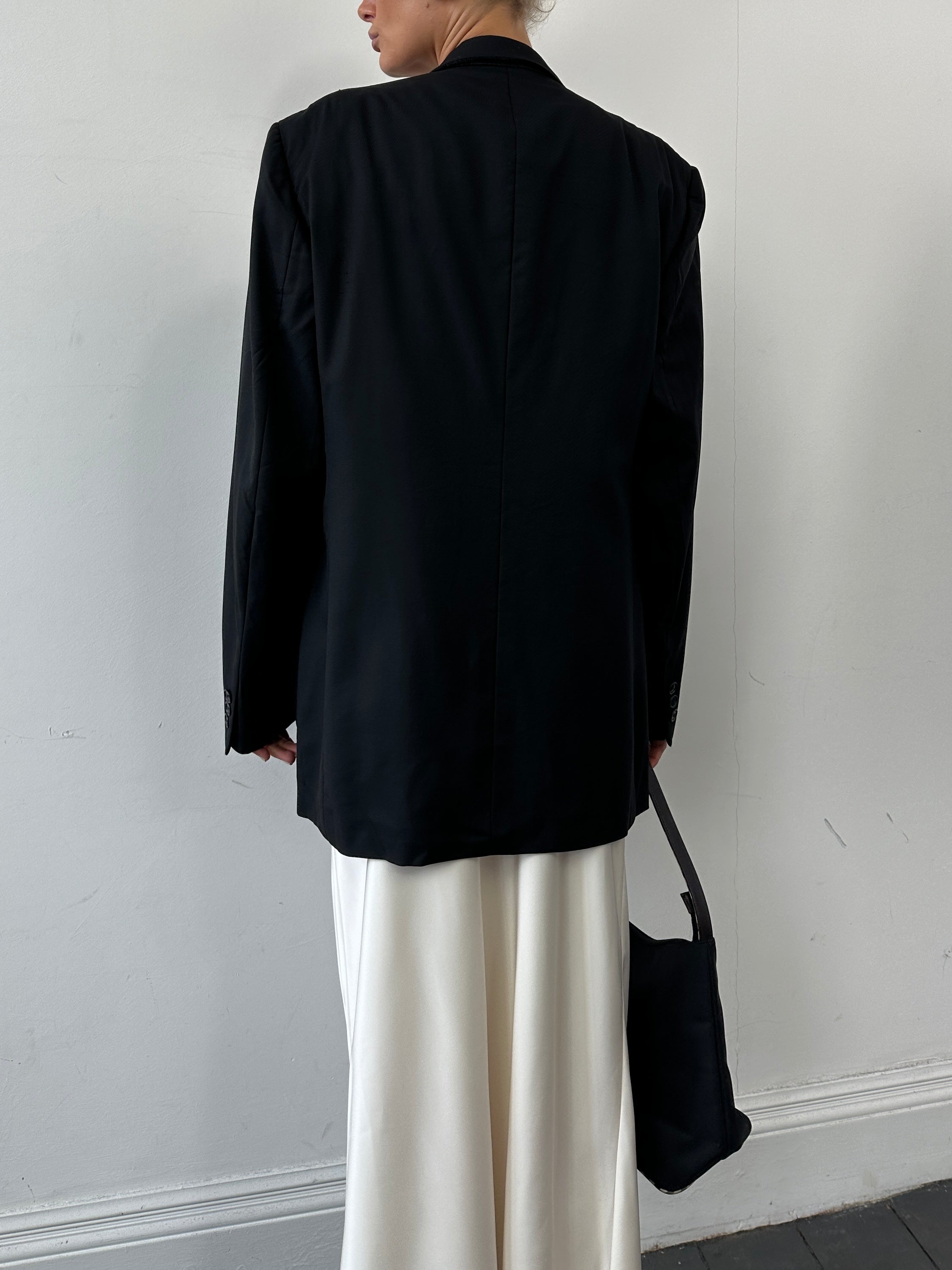 Christian Dior pure wool double-breasted blazer in size L/XL, tailored fit with classic lapels and structured design.