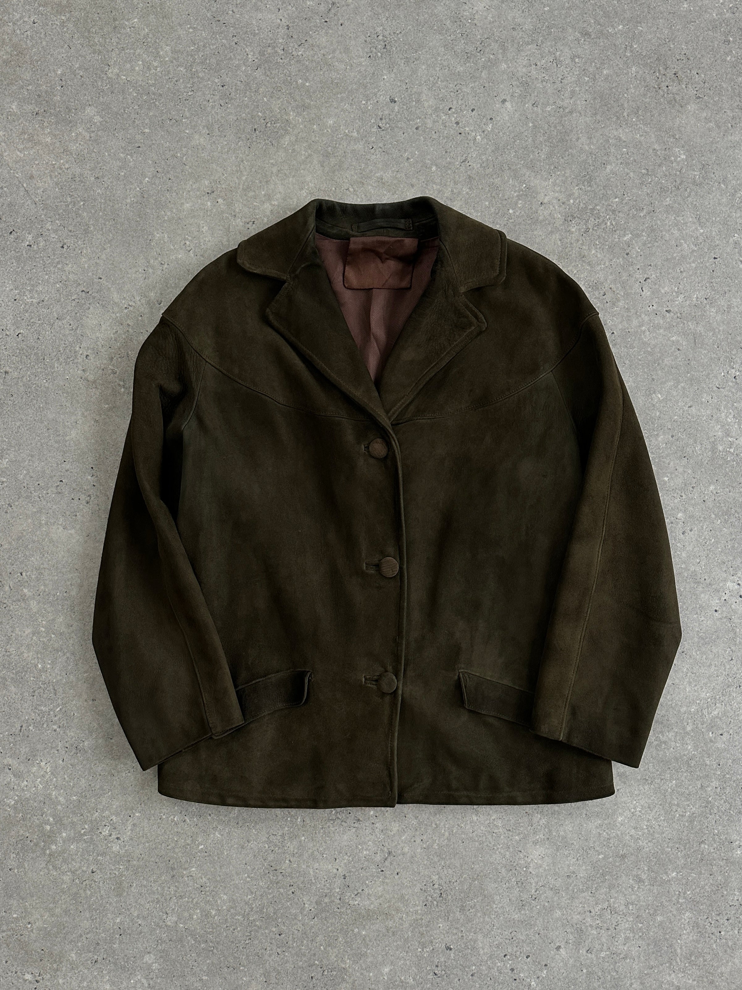 Vintage suede blazer jacket in size M, featuring classic design and tailored fit, shown on a hanger against a neutral background.