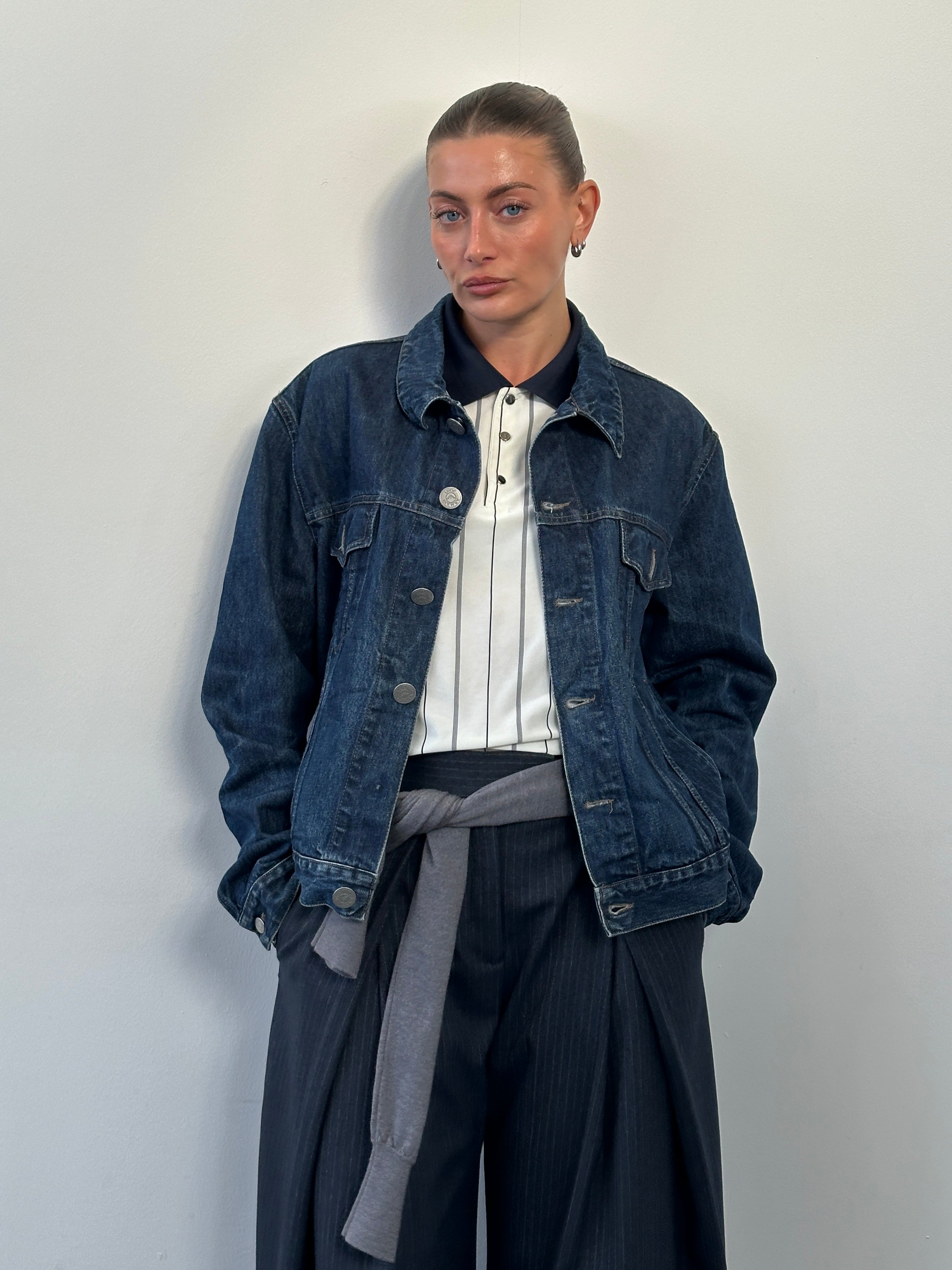 Armani Jeans 1900s mid wash denim jacket in size L, featuring classic design and metal button accents.
