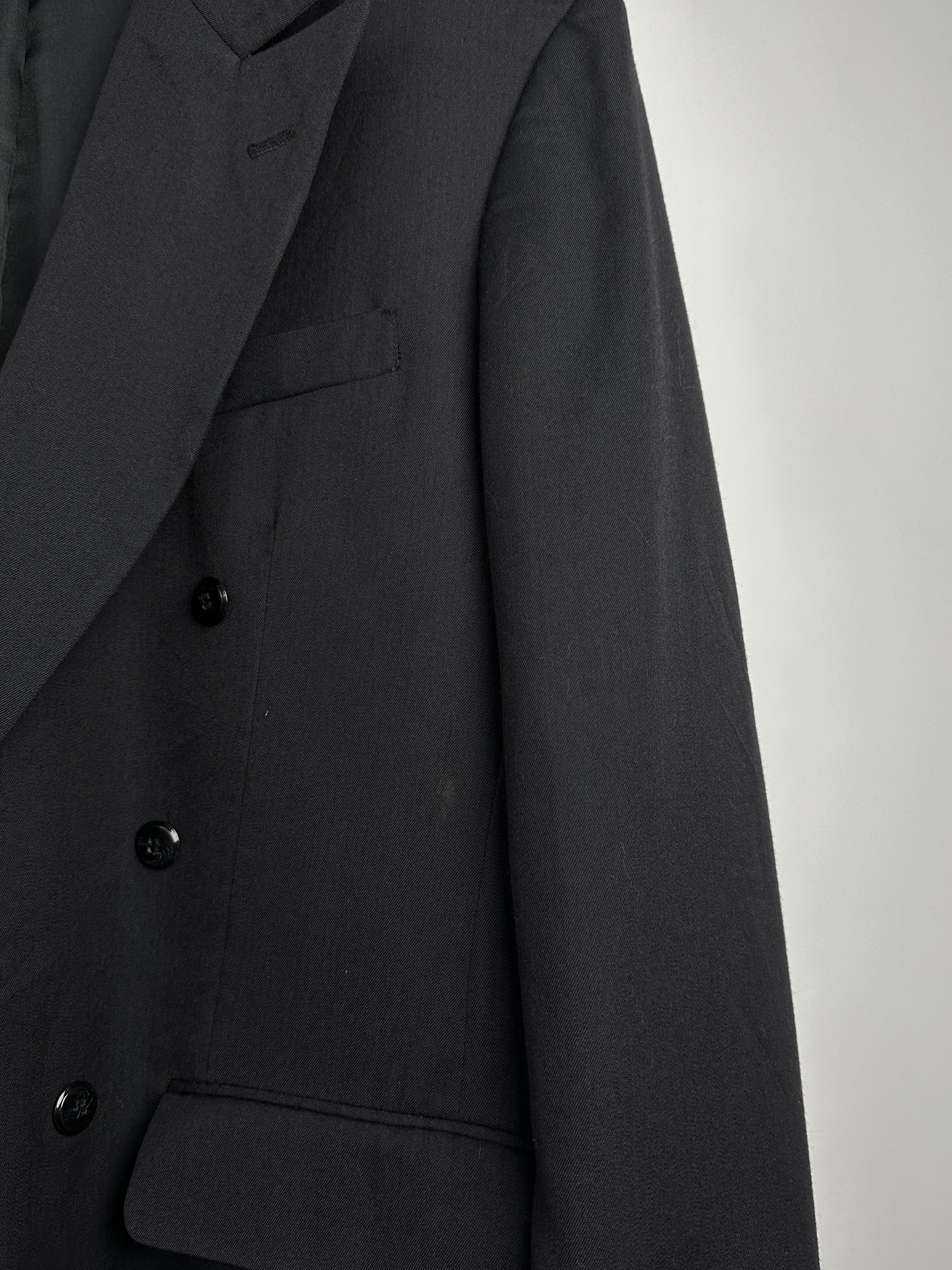 Vintage wool double-breasted blazer in size 40L, featuring classic lapels and tailored fit, displayed on a hanger.