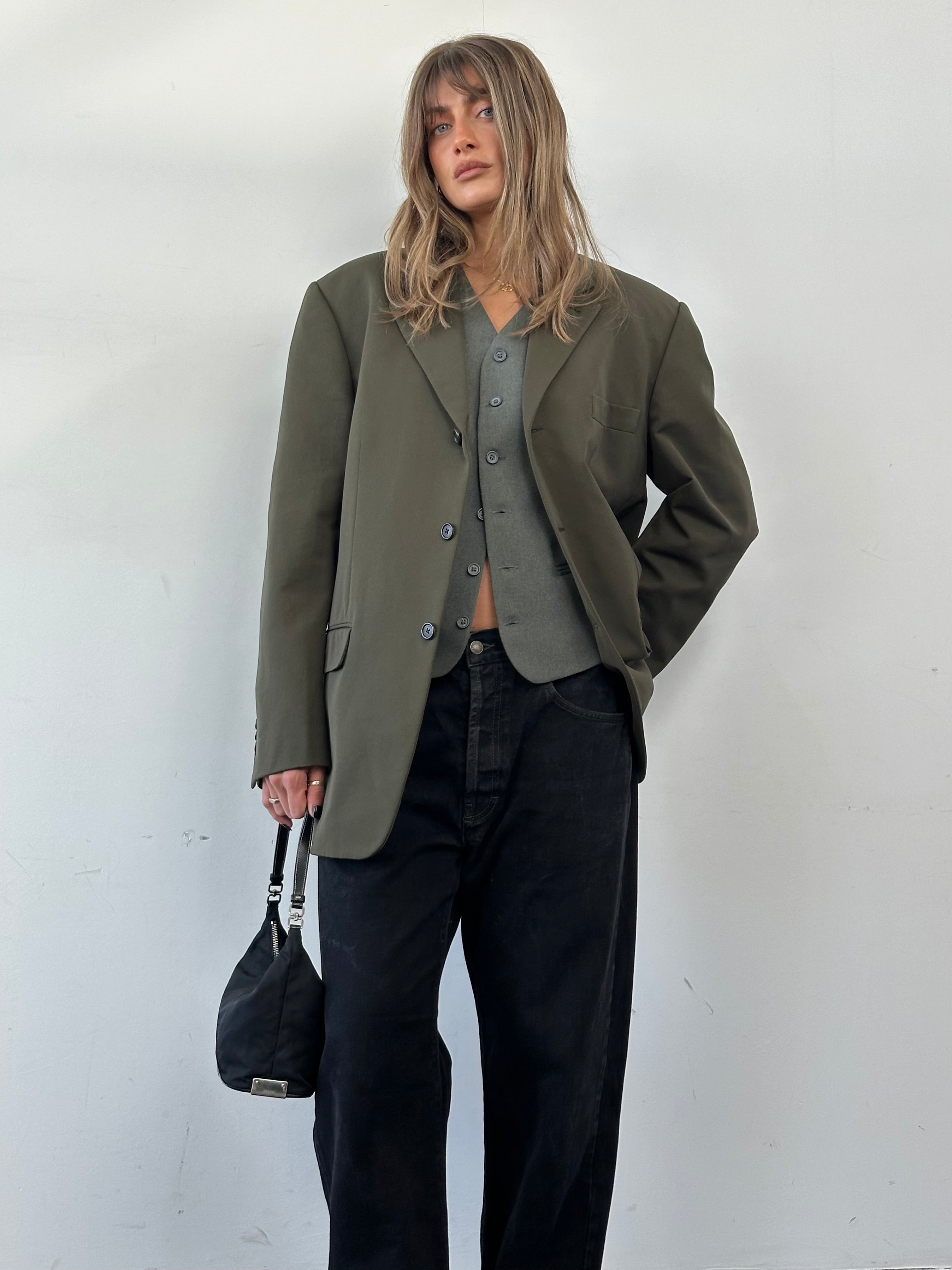 Diesel high-waisted straight-leg denim jeans in W32, shown on a model, with classic blue wash and five-pocket design.