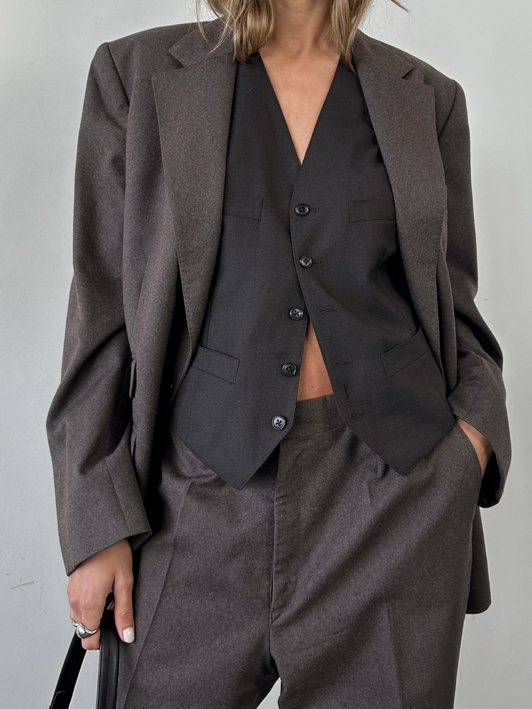 Christian Dior pure wool jumpsuit in size 46R/W34, tailored fit with classic style, shown on a mannequin.