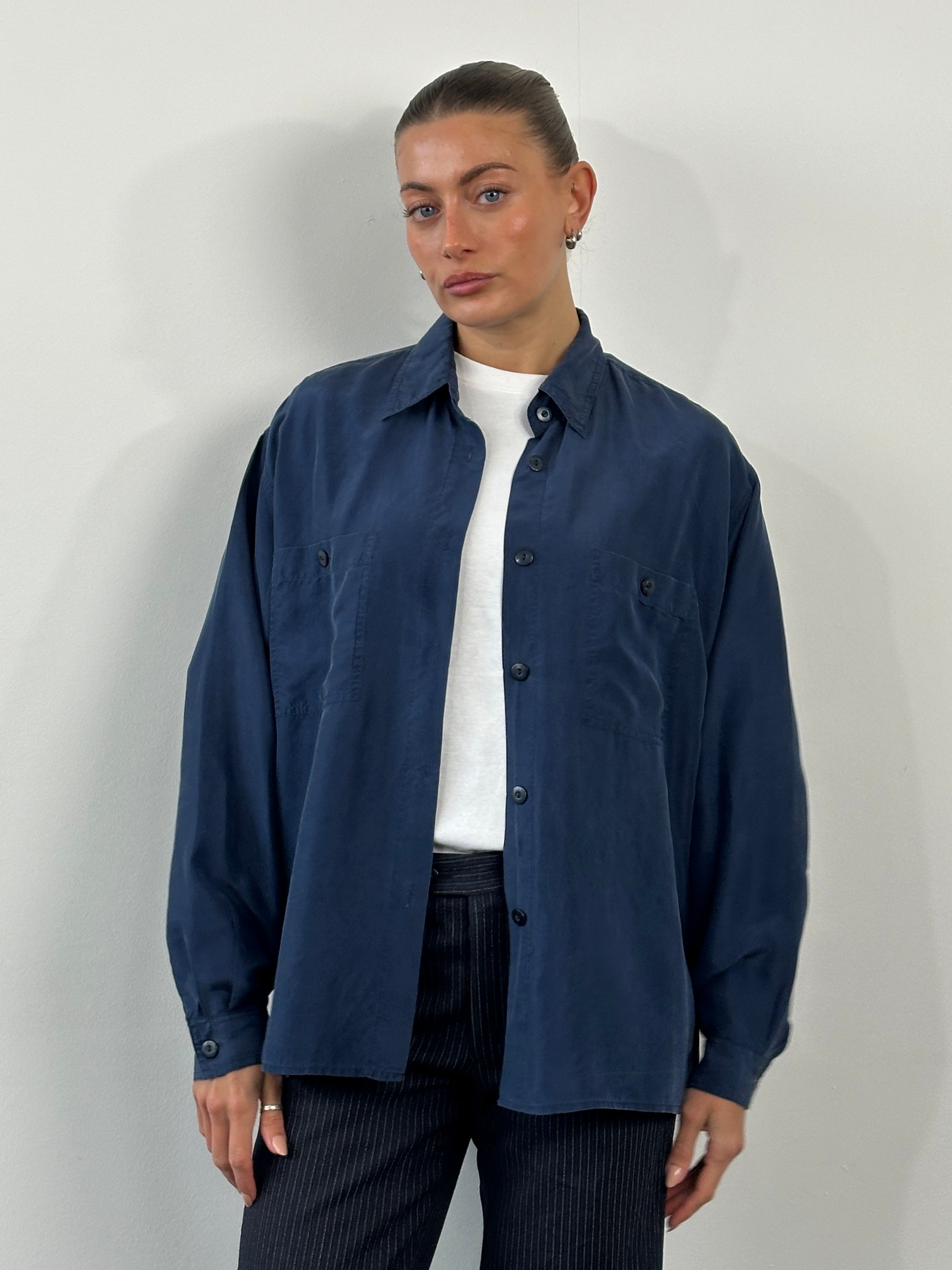 Vintage 1990s pure silk shirt in size large, featuring a classic design and smooth fabric.