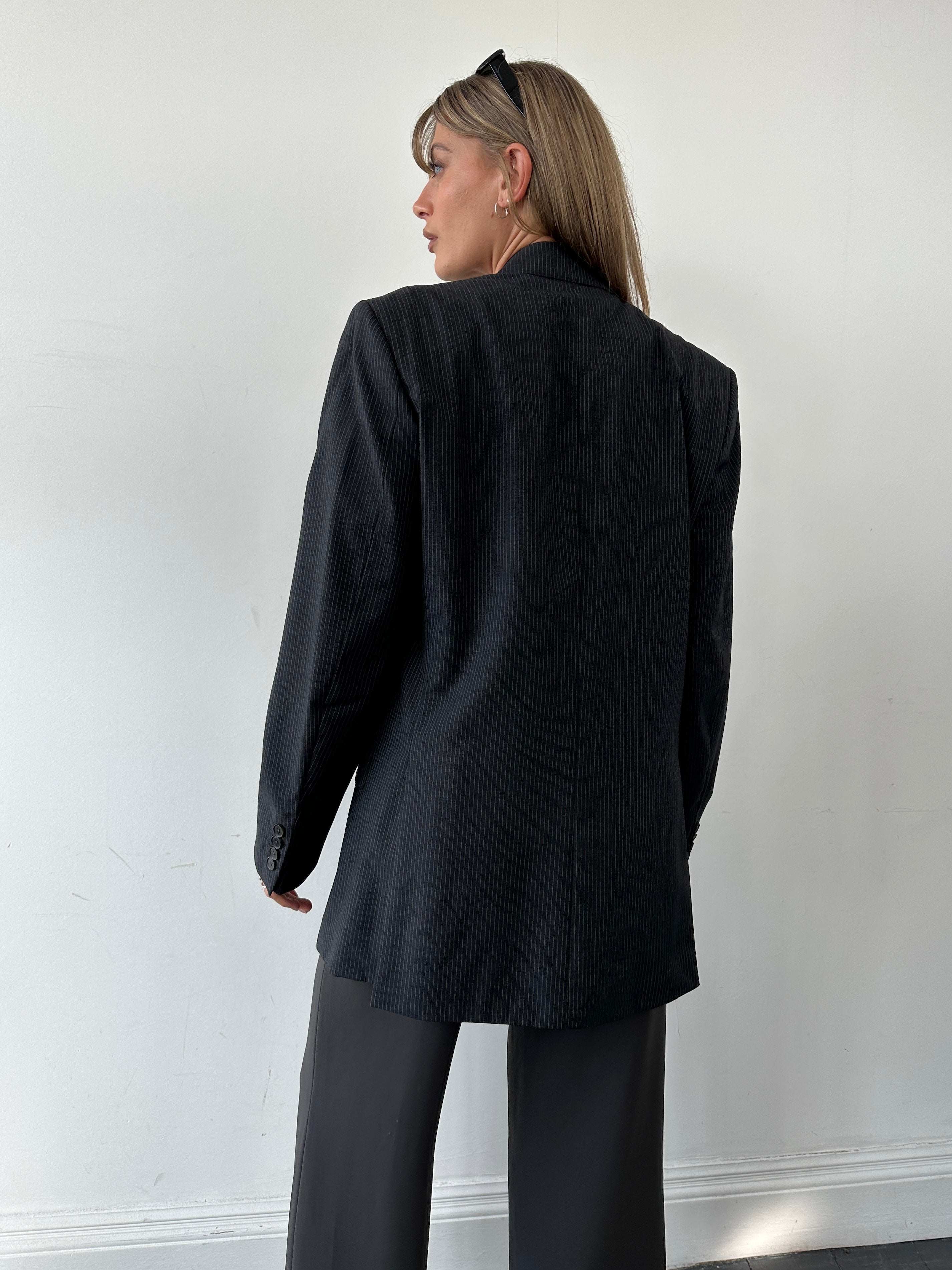 Jaeger pure wool pinstripe blazer in size 40R/M, tailored fit with classic navy and white pinstripe pattern, front view.