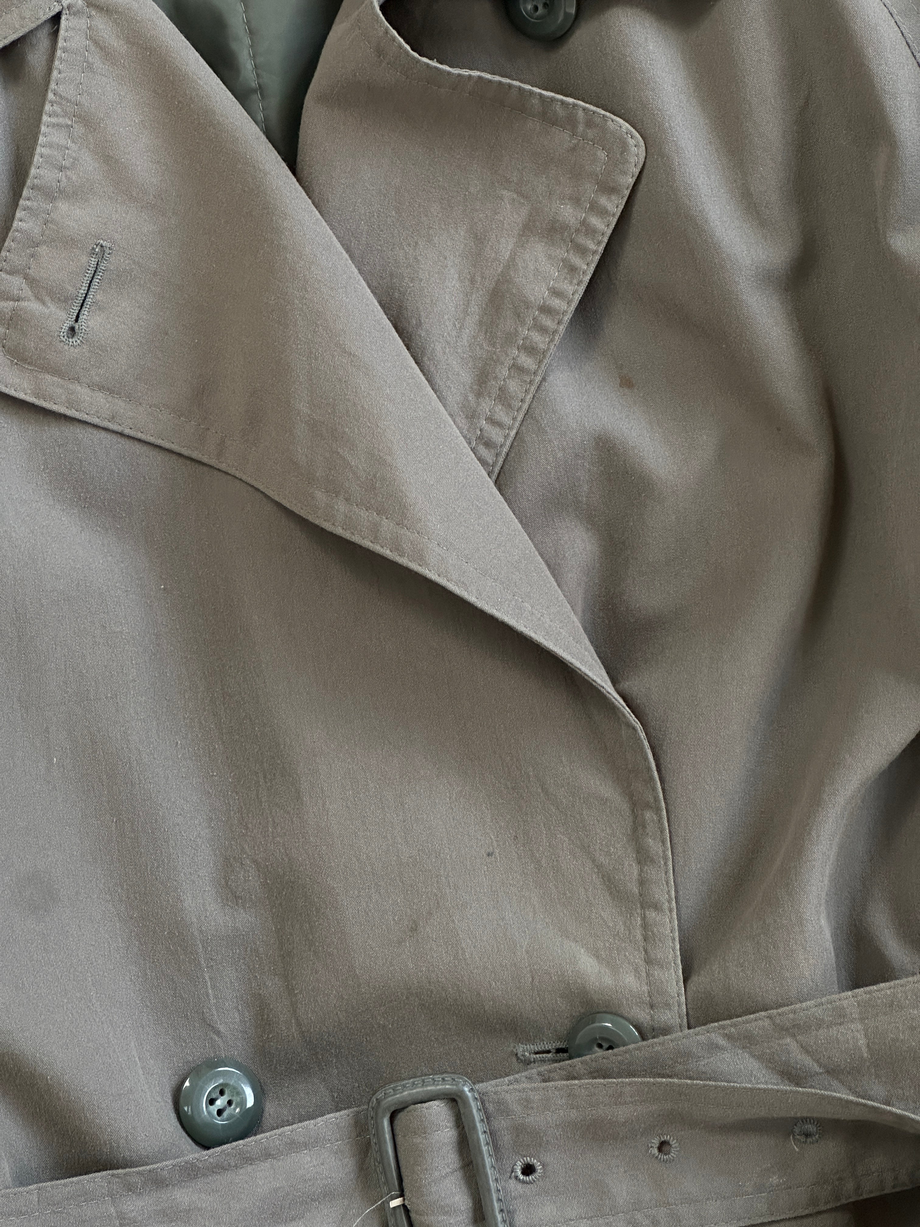 London Fog double-breasted trench coat in classic beige, shown from front with lapels and belted waist. S/M size.