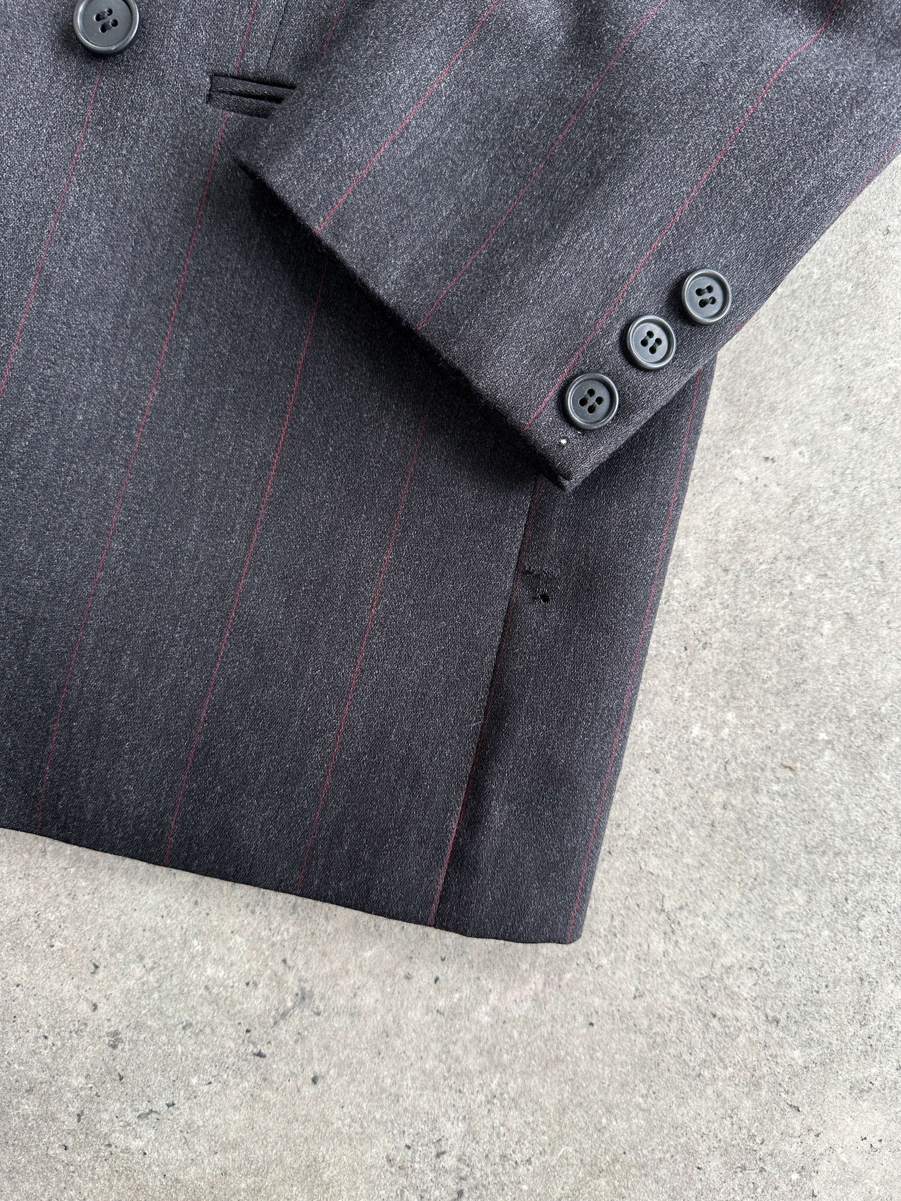 Valentino virgin wool double-breasted blazer in size 36R/S, tailored fit with classic lapel and button closure.