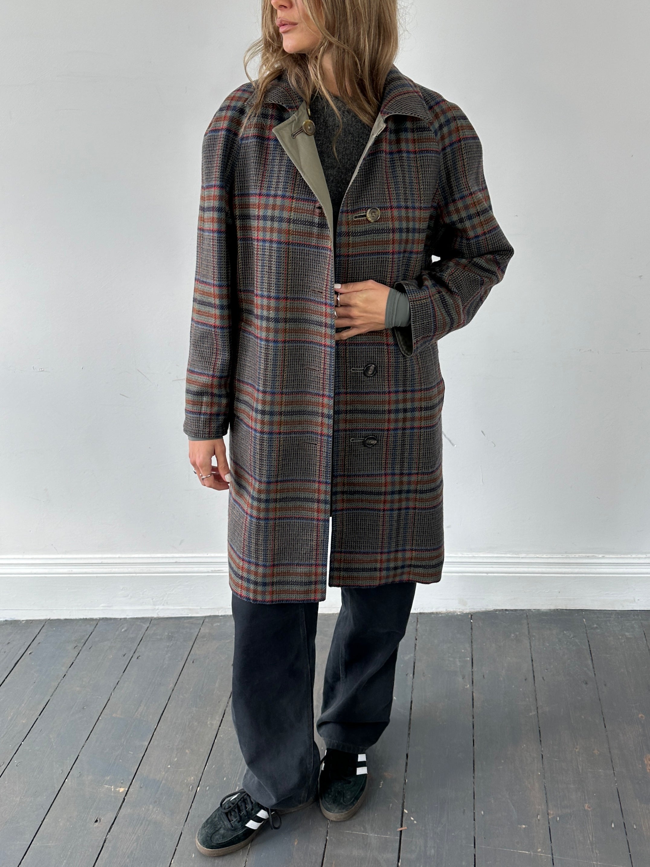 Vintage British vintage reversible wool trench coat, size small, featuring classic style and warm, textured fabric.