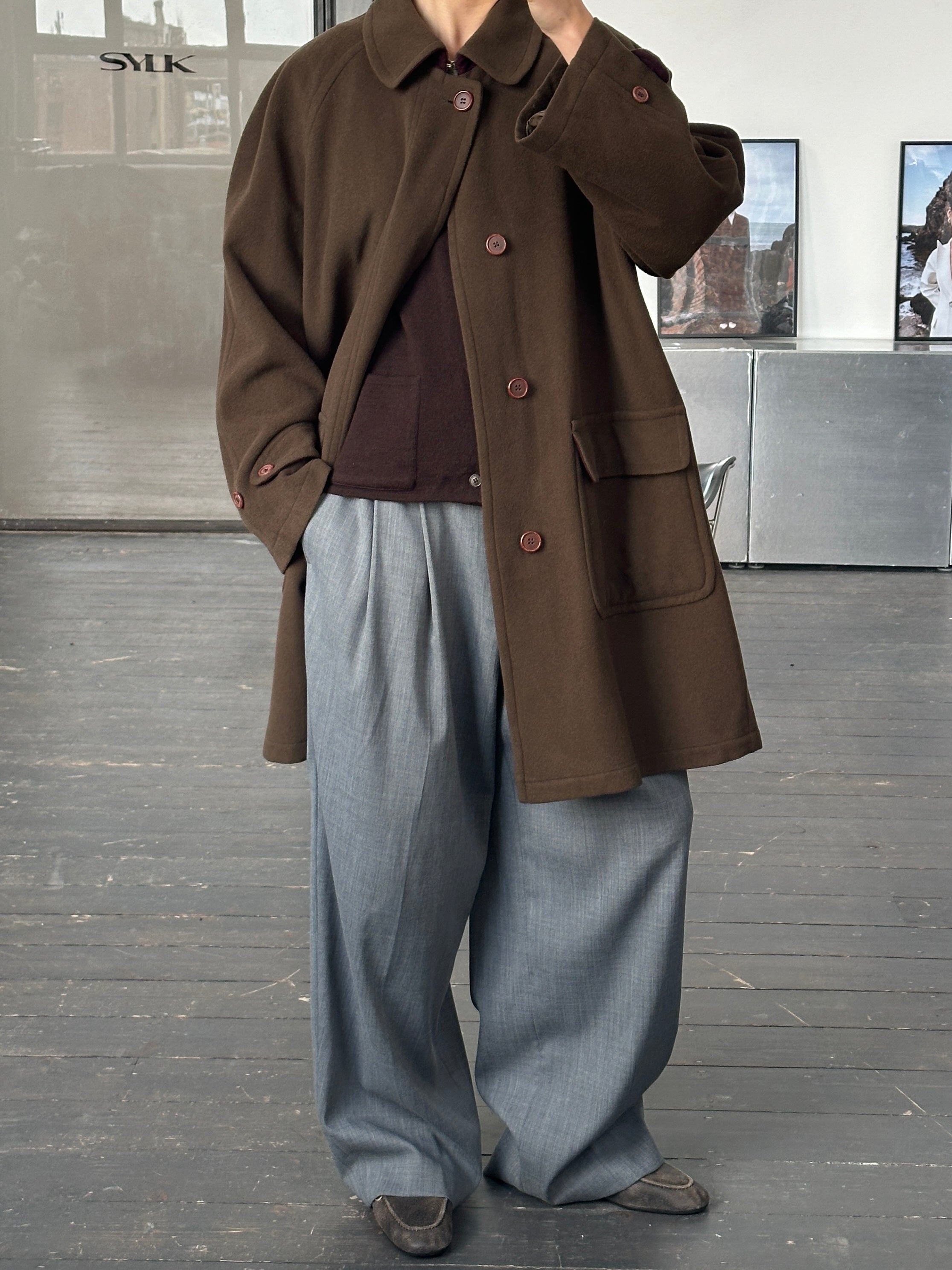 Missoni 1990s wool coat with concealed placket, oversized fit, featuring colorful knit pattern and classic design.