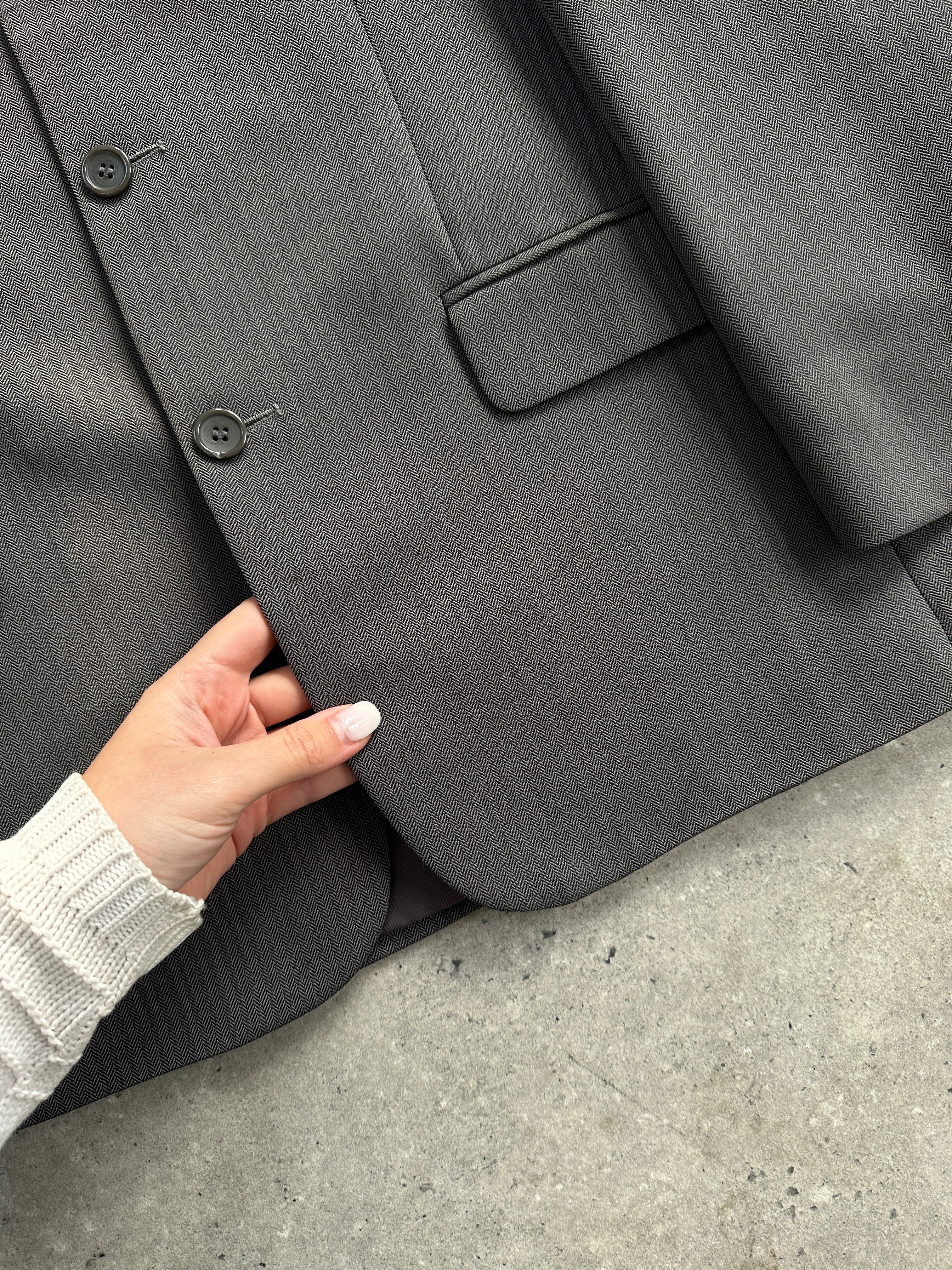Vintage herringbone single-breasted suit jumpsuit, size 38R/W32, featuring classic tailored design and textured fabric.