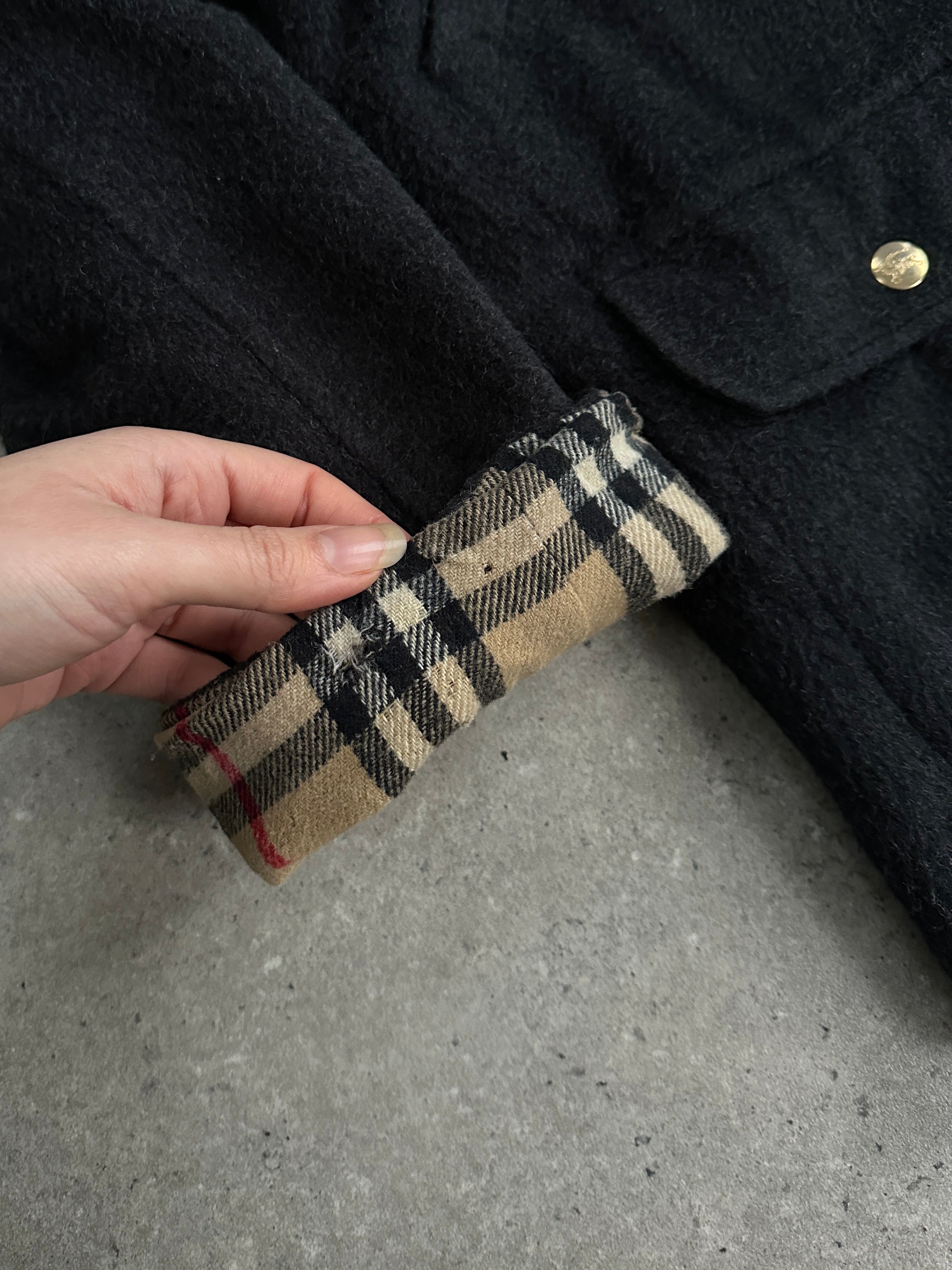 Burberry 1990s wool bespoke button hooded coat in XL displayed on a hanger, showcasing classic design and tailored craftsmanship.