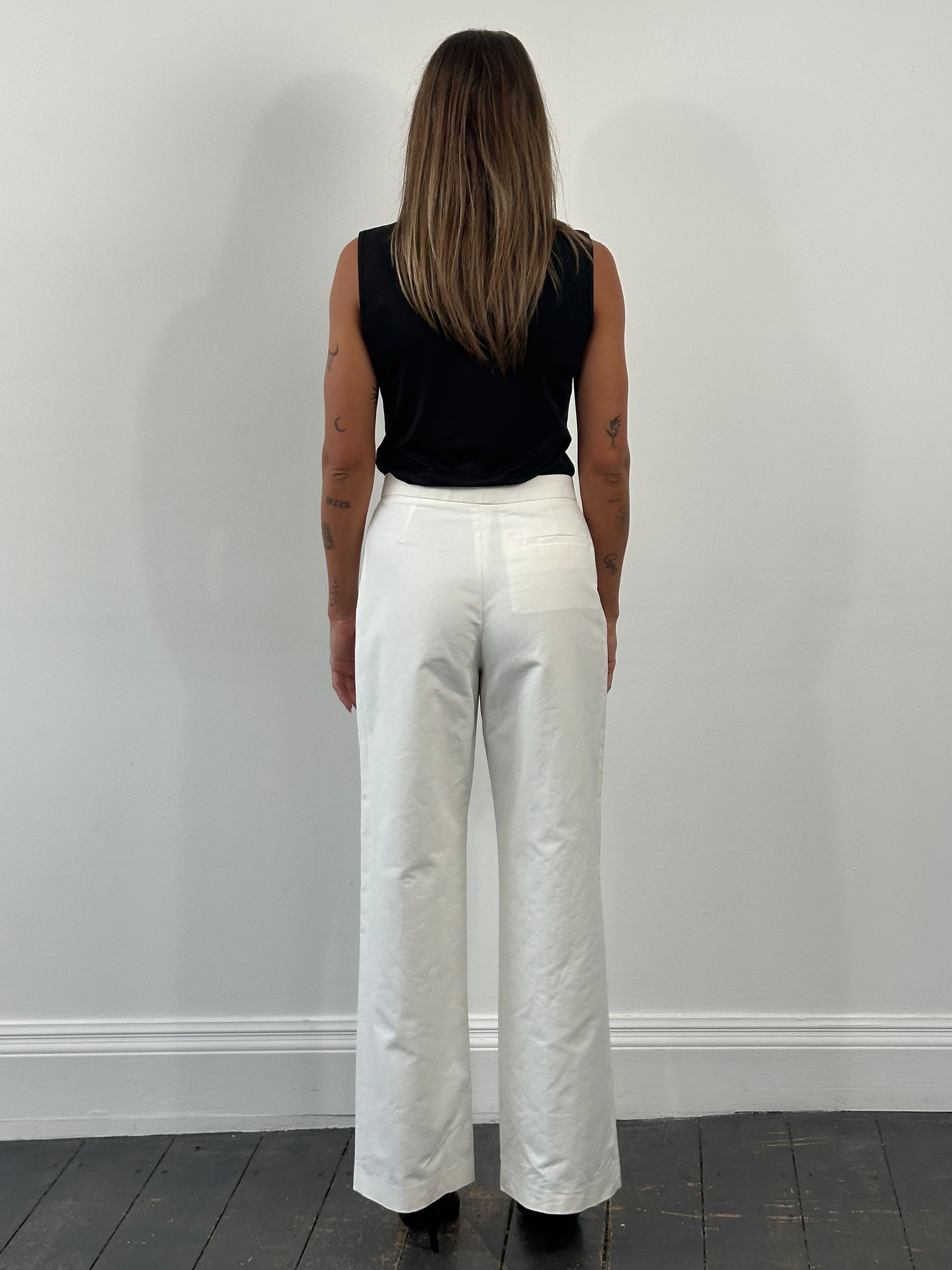 Jil Sander AW23 pure cotton wide-leg trousers in size W28, shown in a neutral color with a relaxed fit and high waist.
