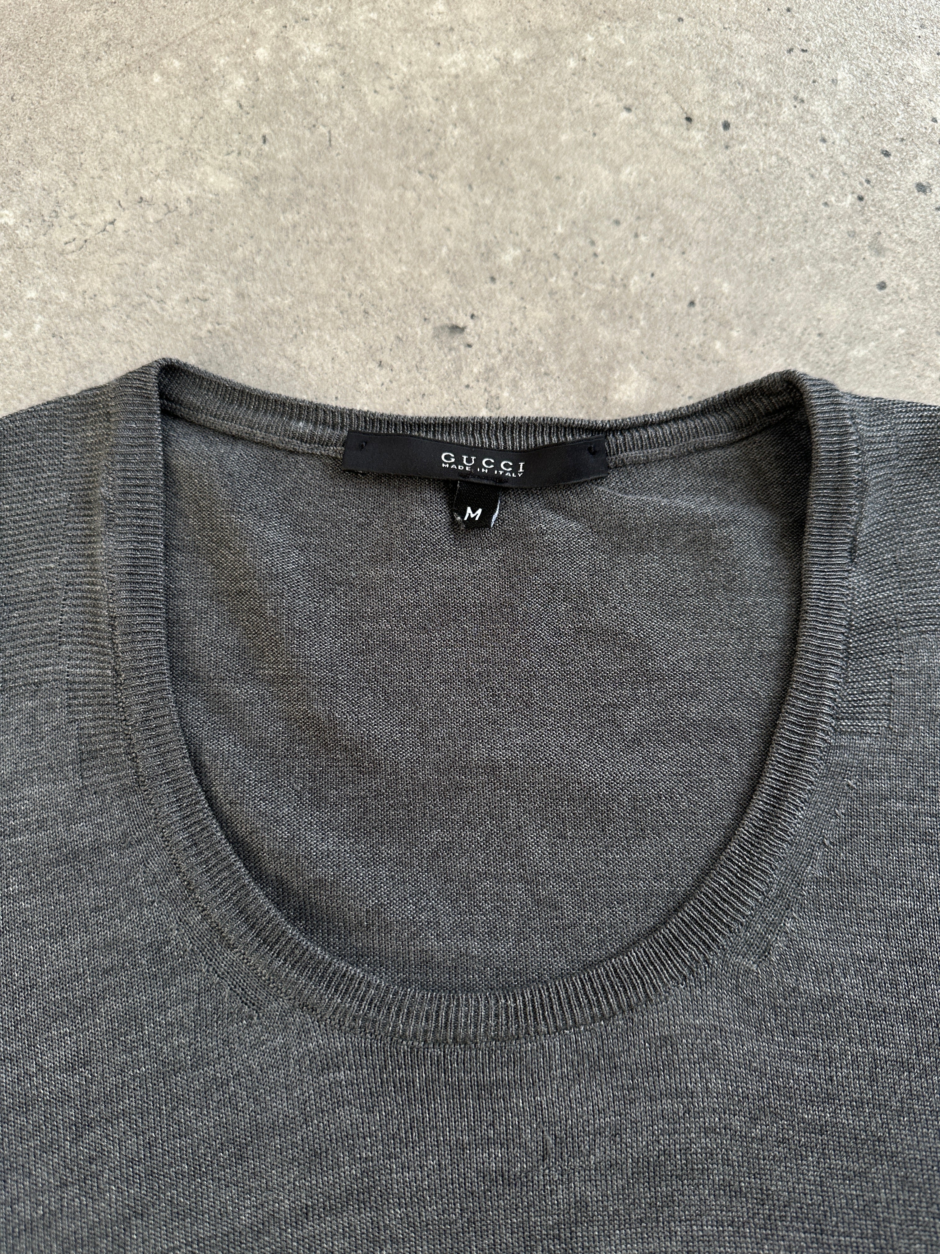 Gucci pure silk lightweight knitted jumper in size M, showing soft fabric and classic design with subtle Gucci branding.